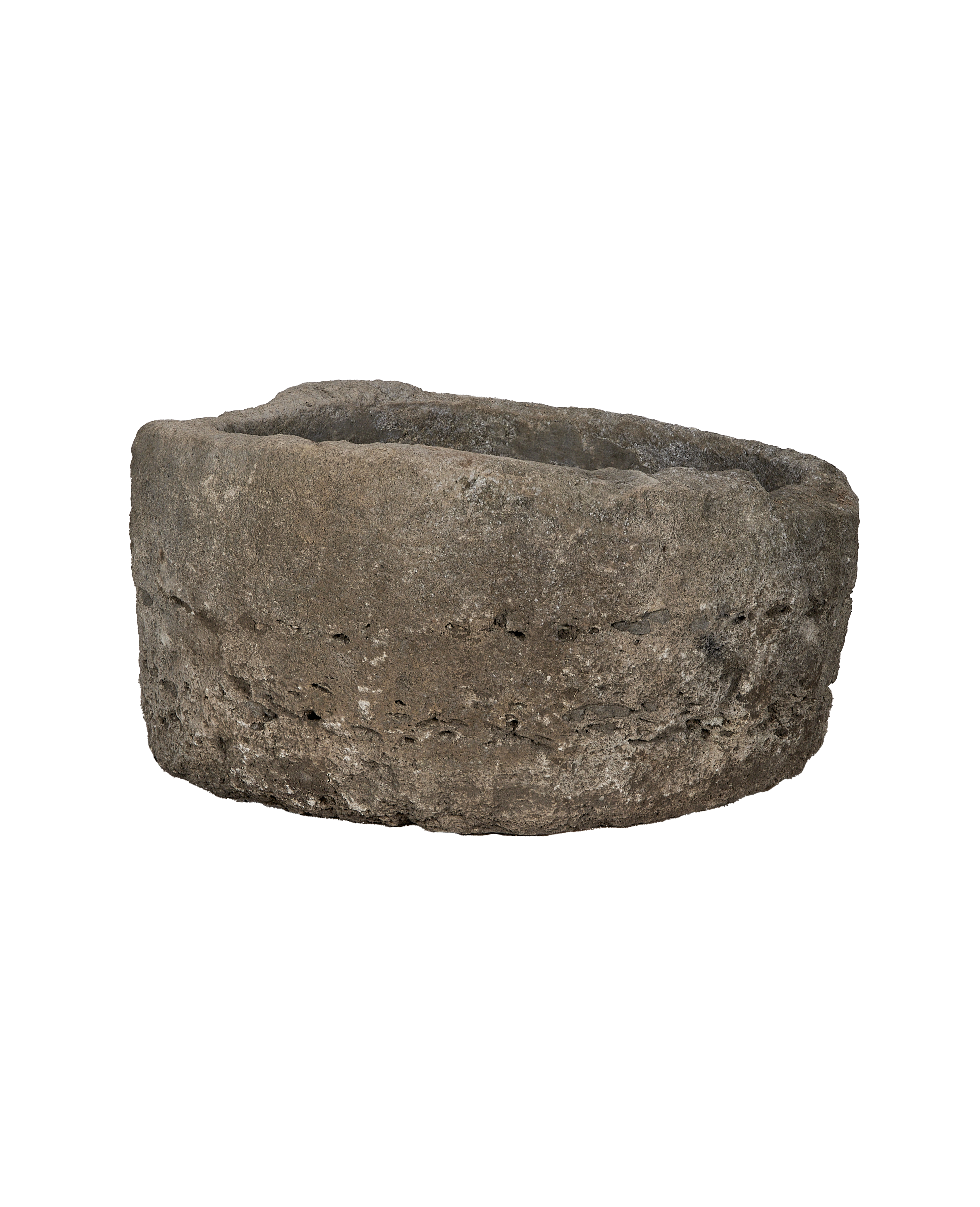 Round vintage weathered limestone trough from Indonesia, with rough, textured surface and aged patina.