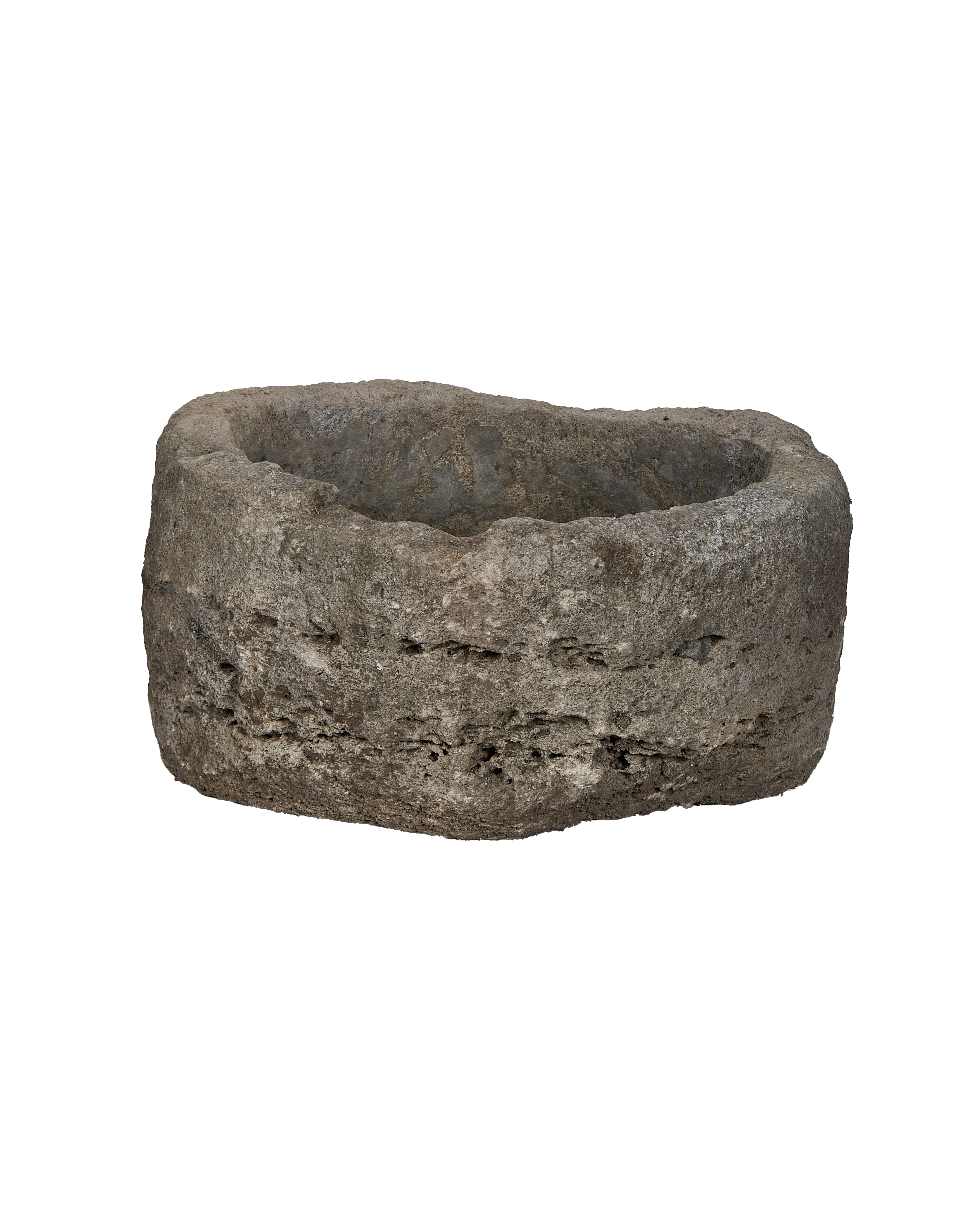 Vintage Indonesian round limestone trough, showing weathered side texture and rough interior details.