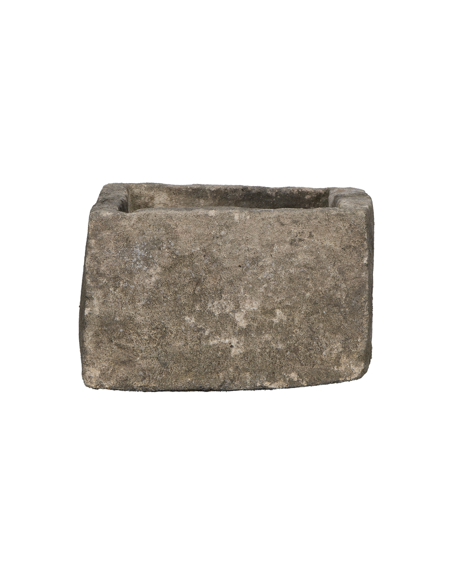 Vintage Indonesian rectangular limestone trough showing rough textured stone side.
