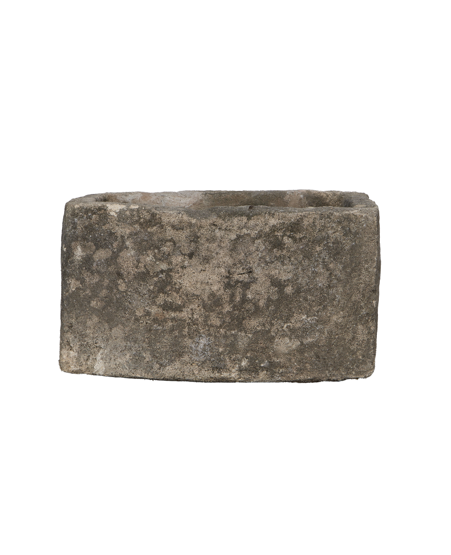 Vintage Indonesian rectangular limestone trough showing weathered, textured stone surface and rough-hewn edges.