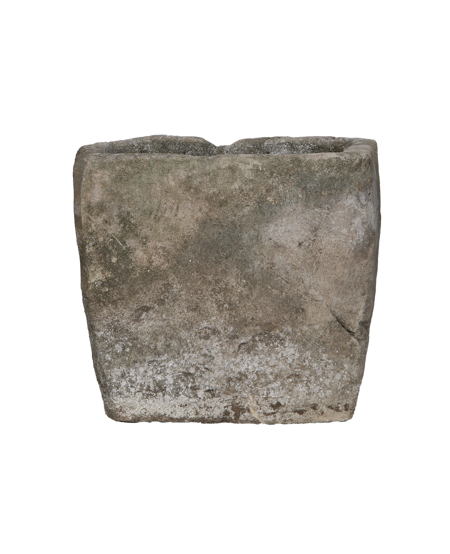 Vintage Indonesian limestone rectangular trough, showing weathered side texture with white mineral deposits.