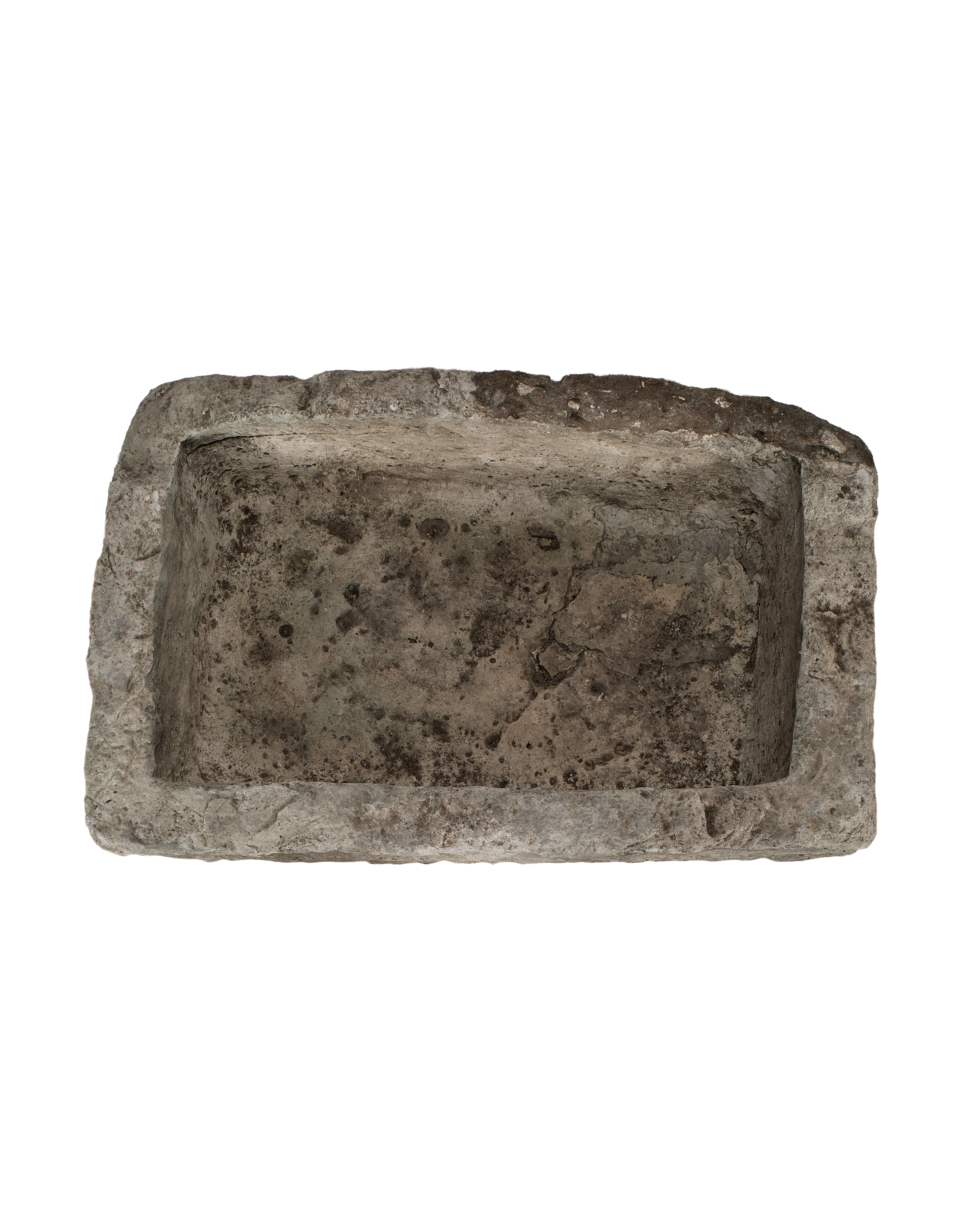 Vintage Indonesian limestone trough, top-down view showing deep rectangular basin and rough texture.