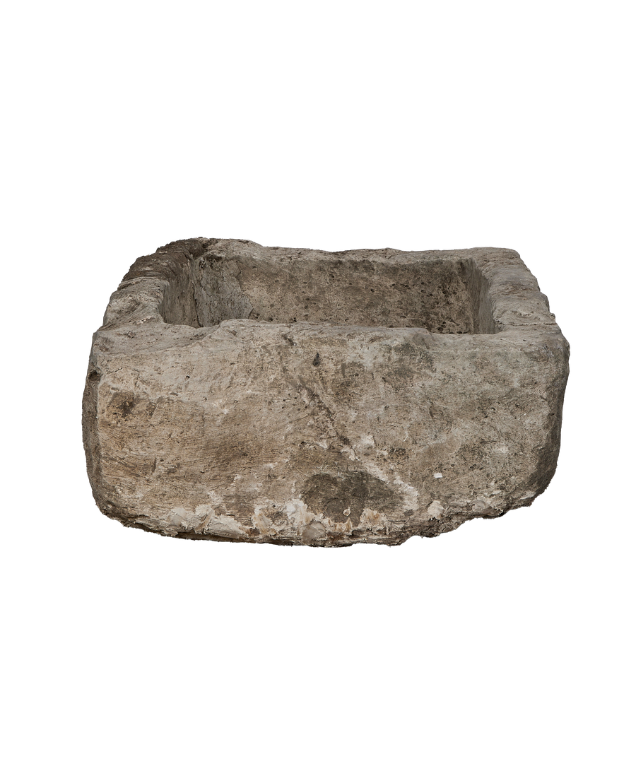 Vintage Indonesian limestone trough, rectangular, showcasing its textured, weathered exterior from a slightly elevated angle.