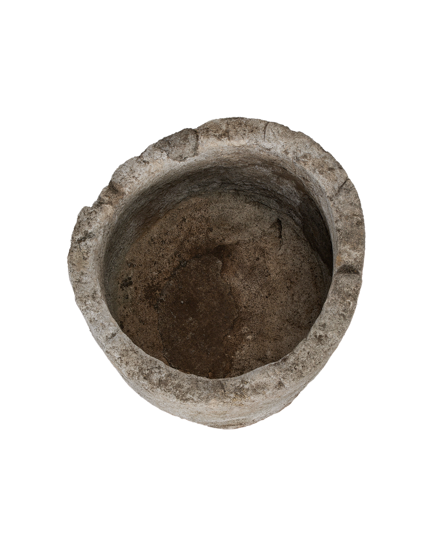 Vintage Indonesian round limestone trough, top-down view showing interior texture and depth.