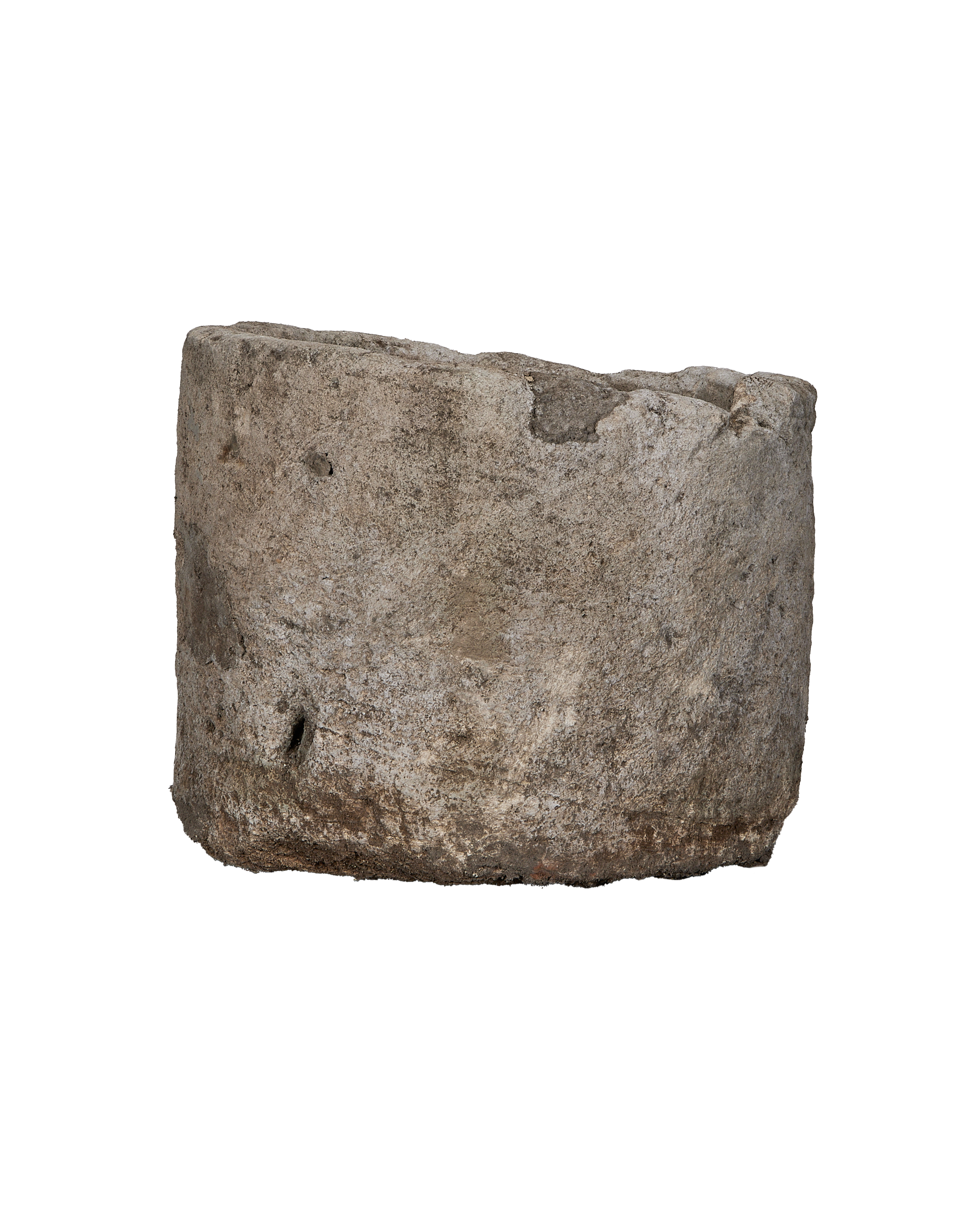 Vintage Indonesian round limestone trough, showing weathered texture and natural imperfections, side angle.