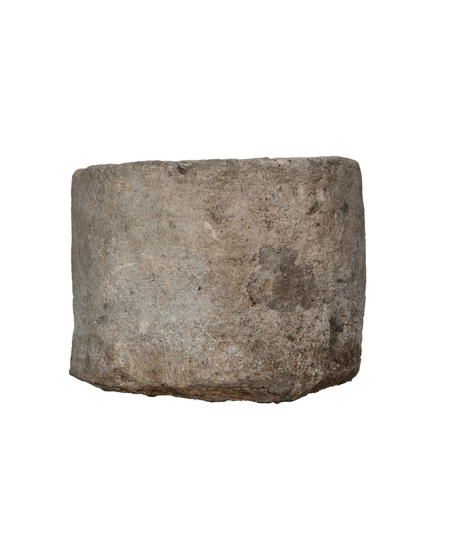 Vintage round Indonesian limestone trough showing weathered surface texture.
