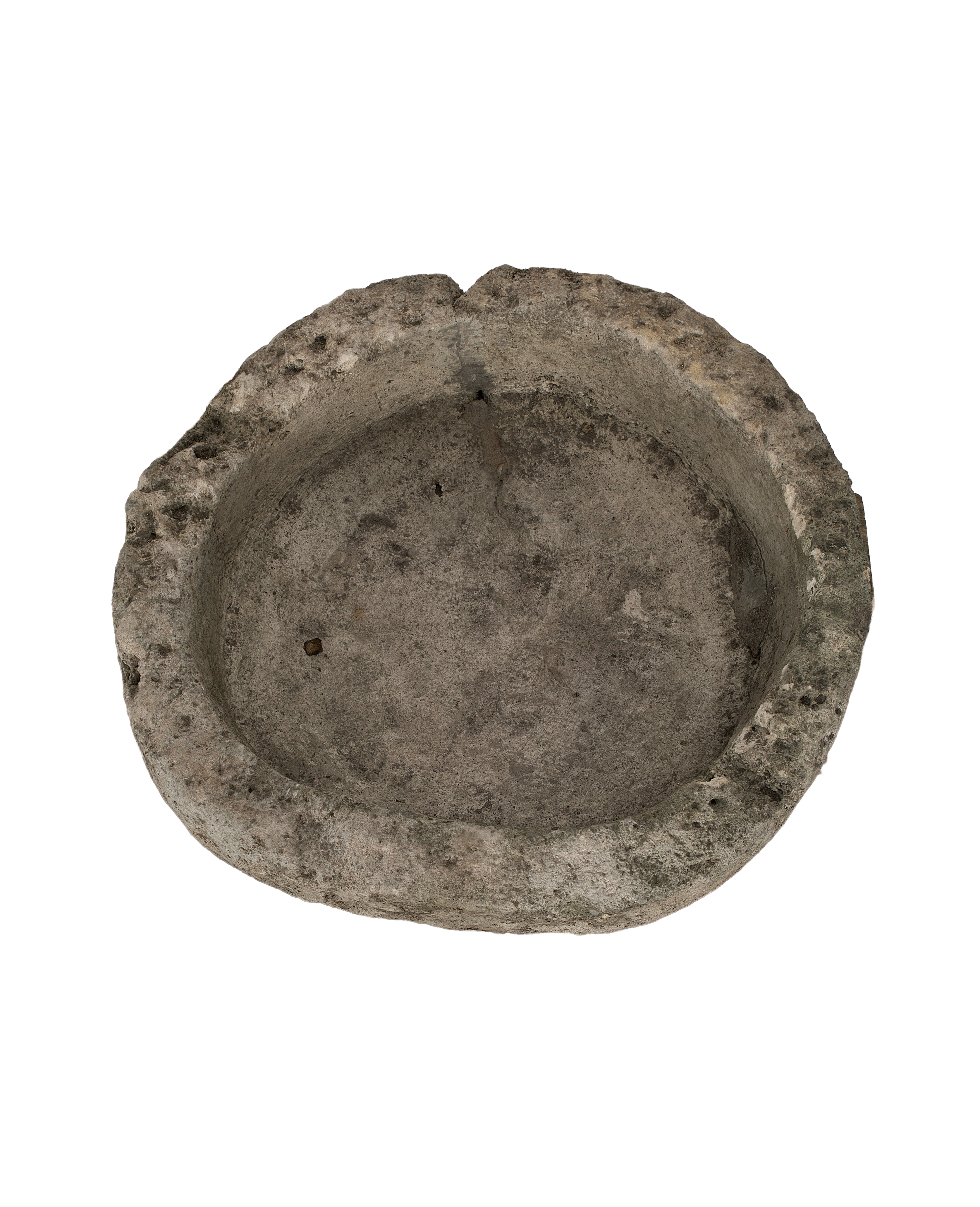 Vintage round limestone trough from Indonesia, top view showing weathered interior texture.