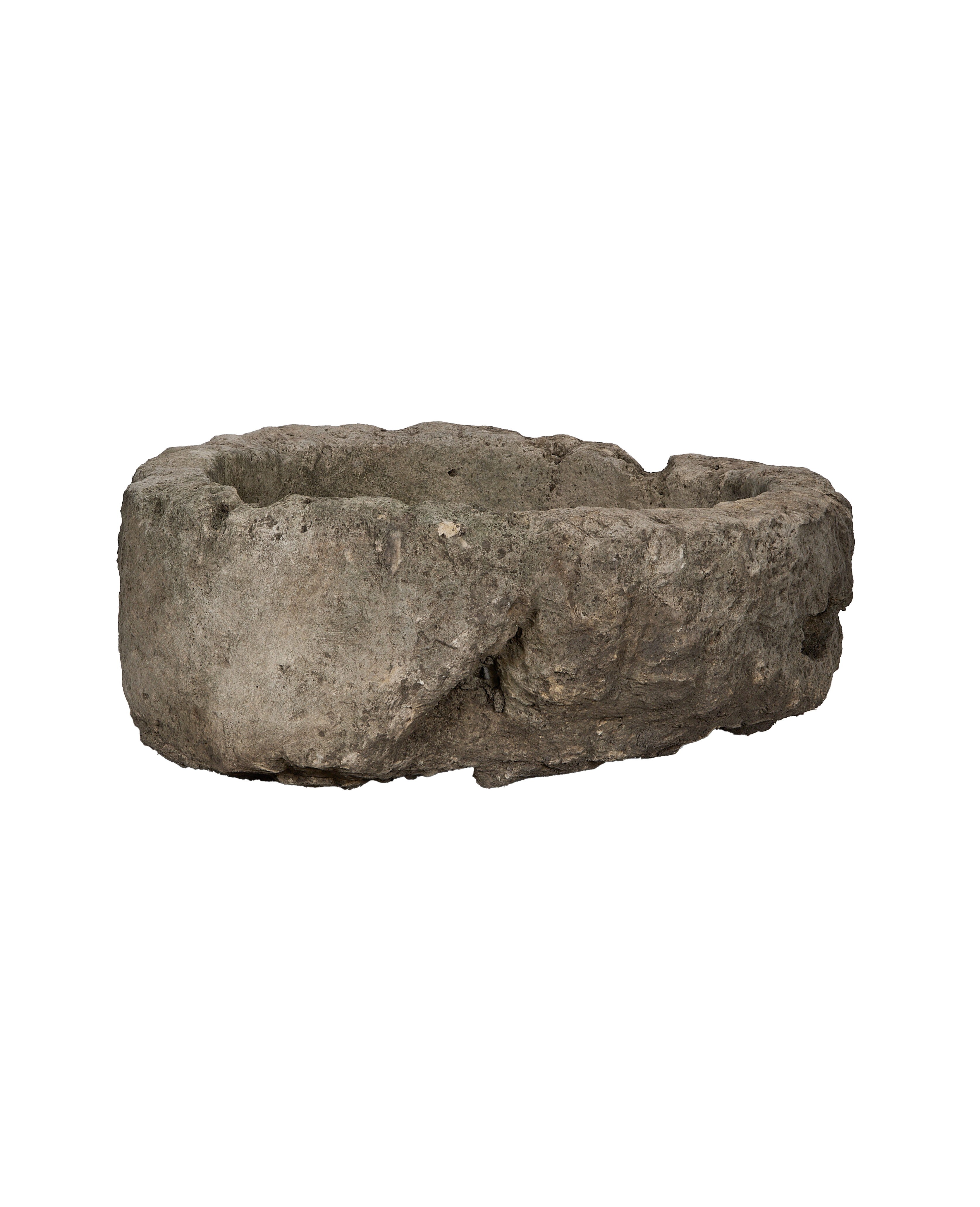 Vintage Indonesian naturally weathered limestone trough, showing a side view with texture.