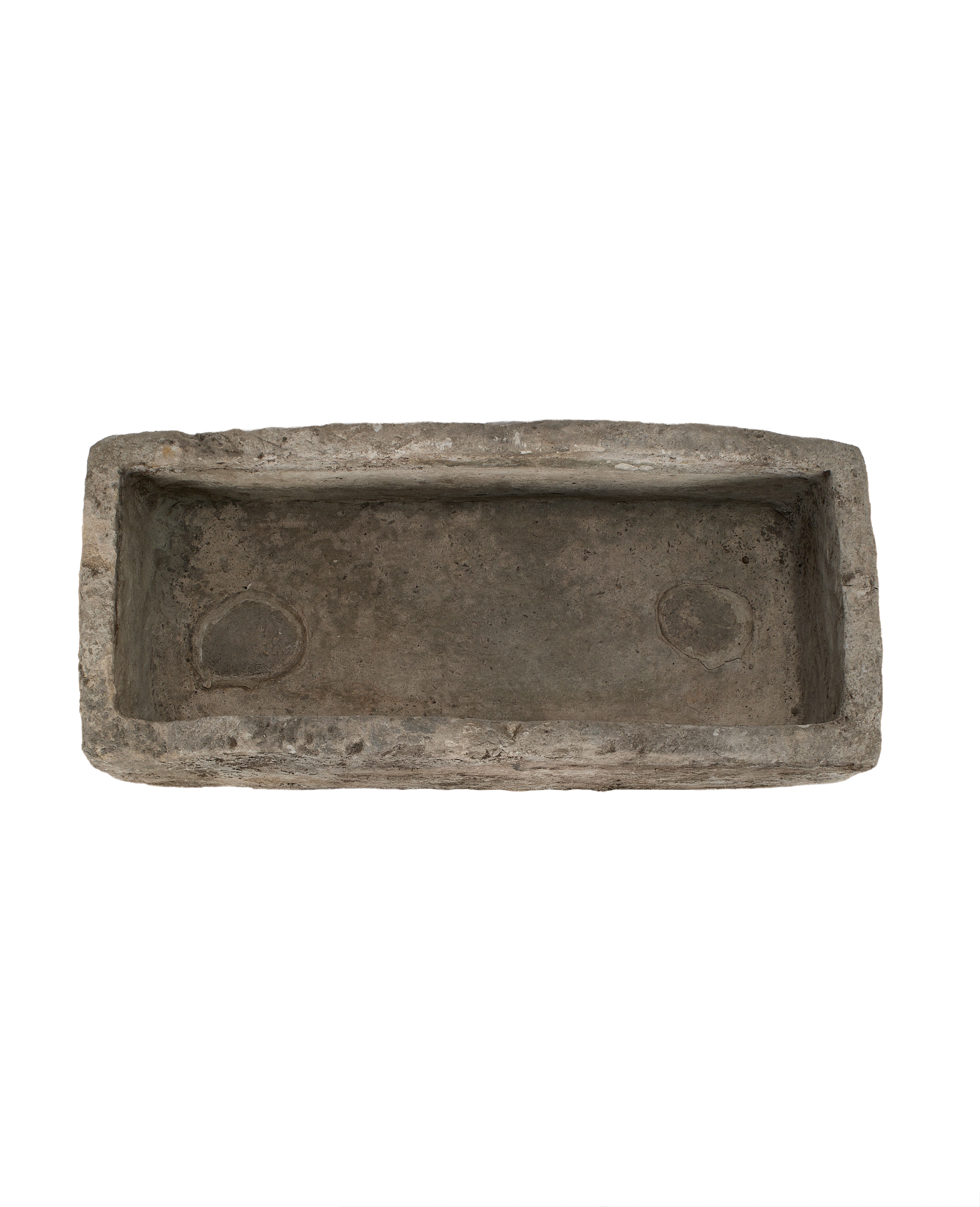 Vintage Indonesian limestone trough, top-down view showing interior rectangular basin with rounded drainage spots.