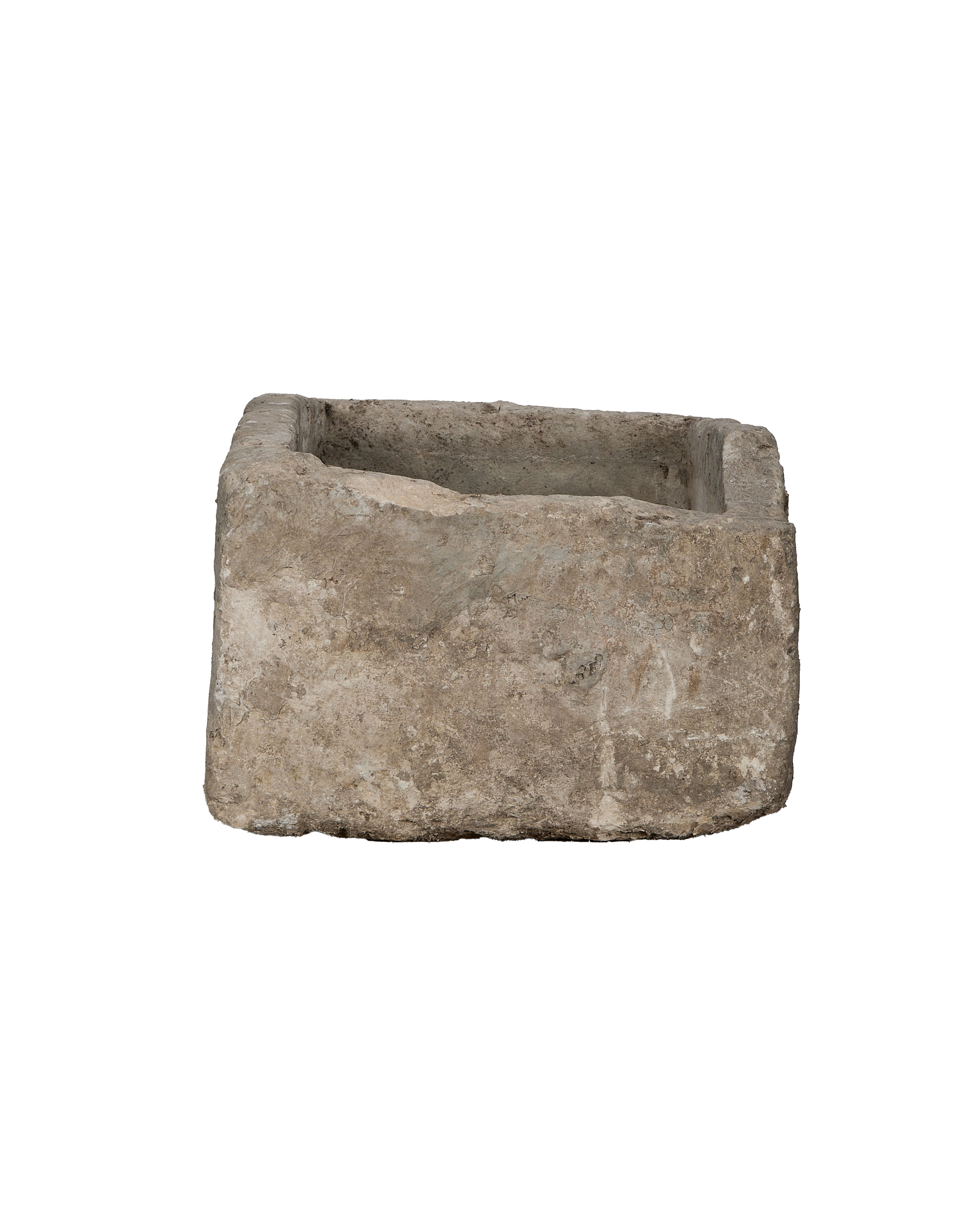 Vintage Indonesian limestone trough viewed from 3/4 angle, showing its rugged texture.