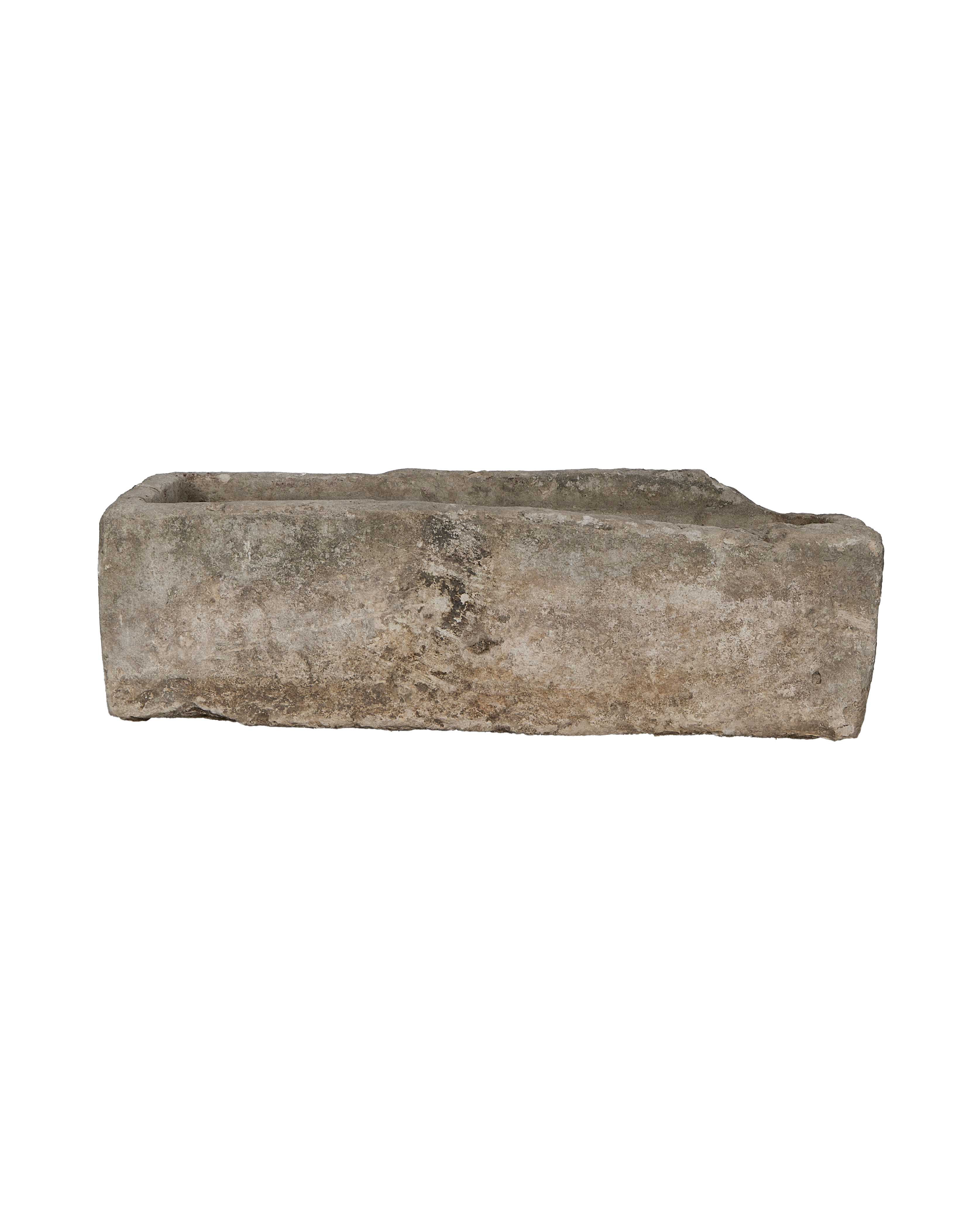 Long, rugged vintage limestone trough from Indonesia, showing a weathered top edge.