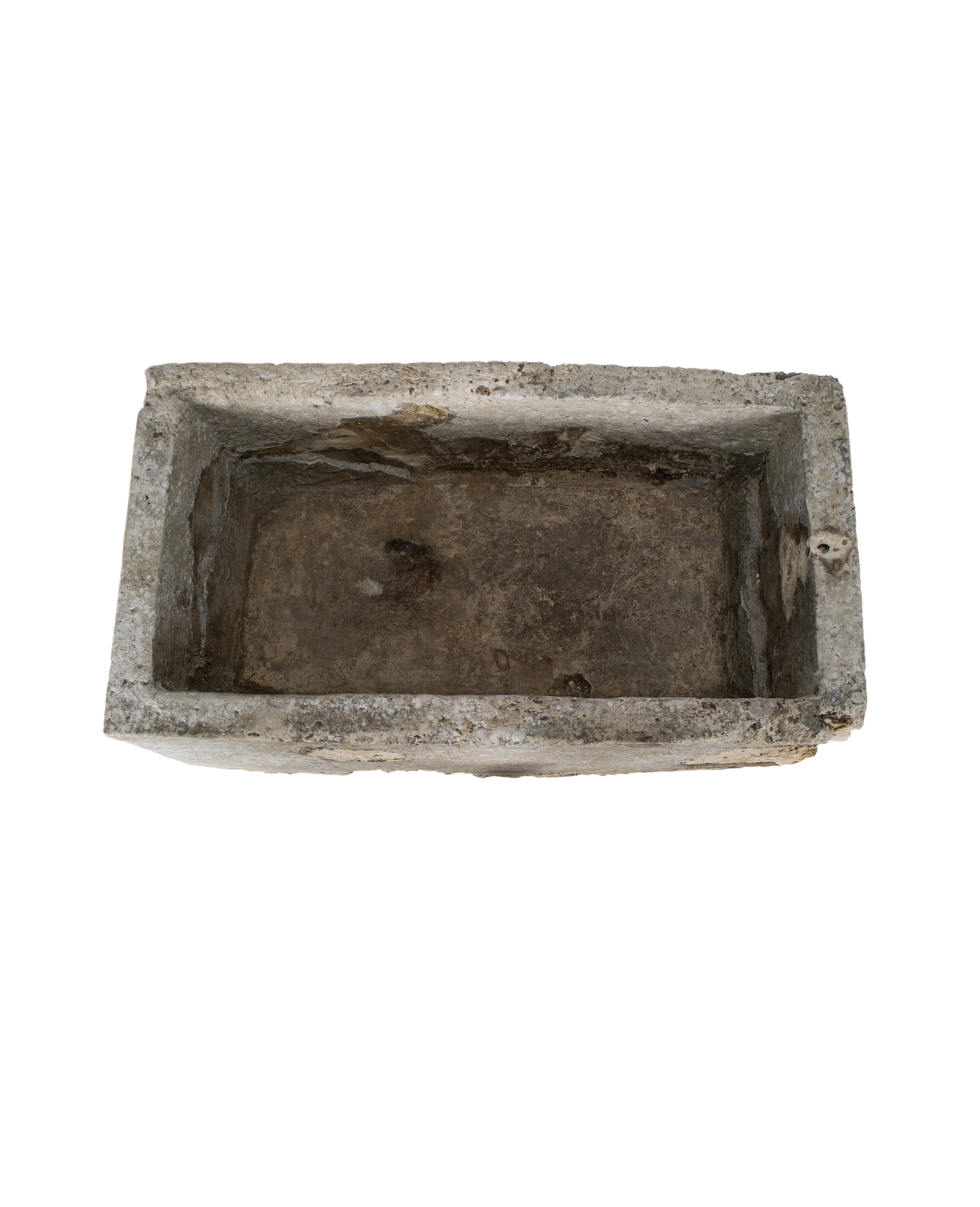 Vintage limestone trough from Indonesia, weathered interior texture, aerial view.