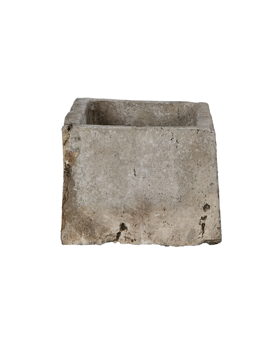 Vintage rectangular limestone trough, front-facing view showing weathered texture and sturdy construction.
