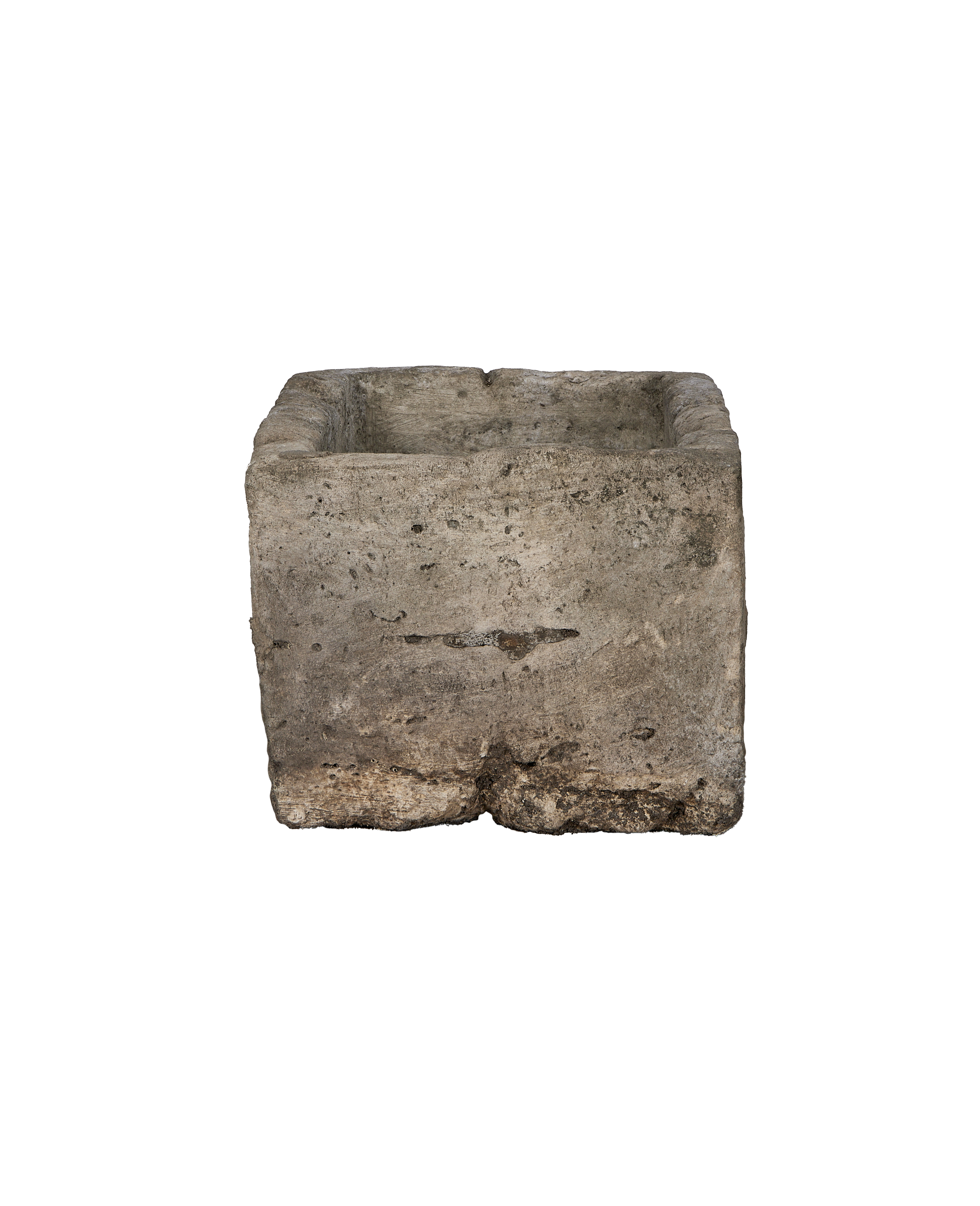 Vintage rectangular limestone trough, close-up texture detail showing weathered surface and irregularities.