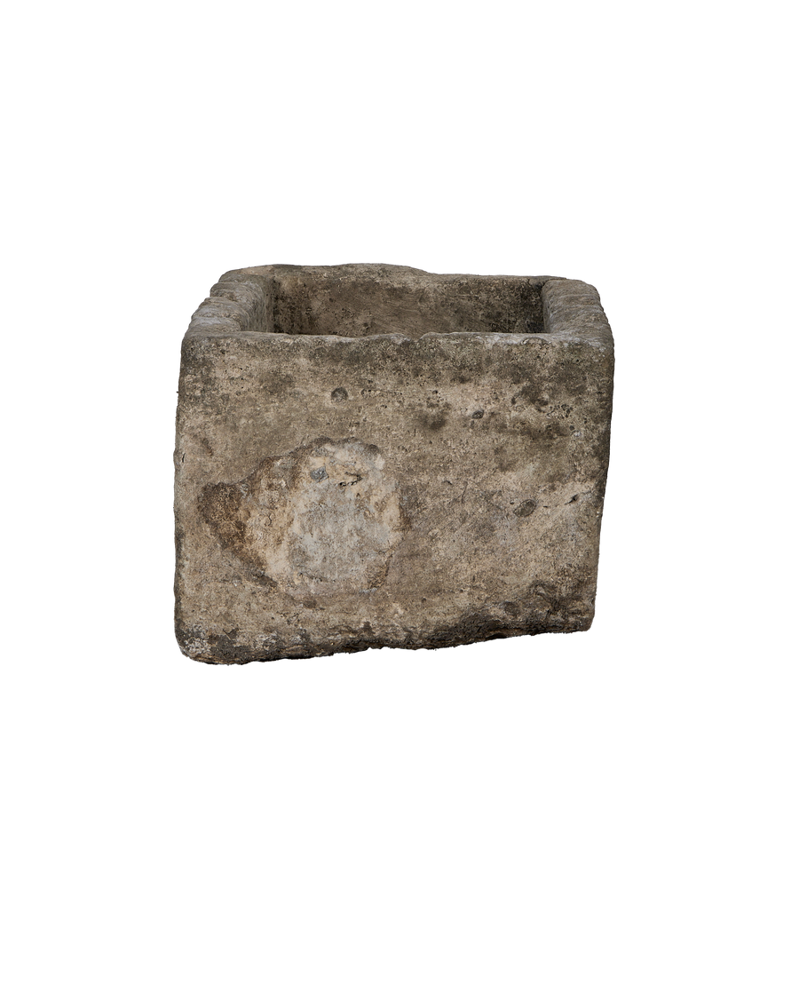 Vintage Indonesian limestone rectangular trough, showing uneven texture and weathered patch on side.