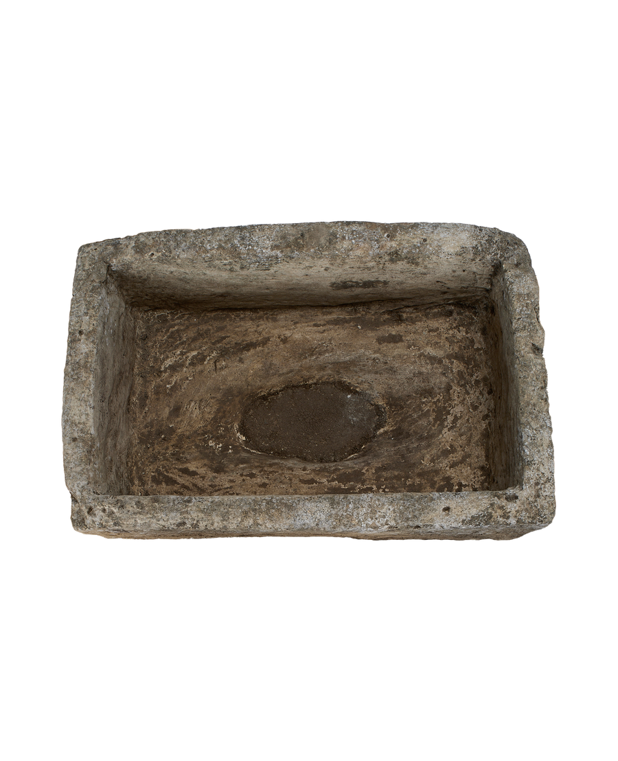 Vintage Indonesian limestone trough viewed from above, showing rectangular shape and weathered interior.