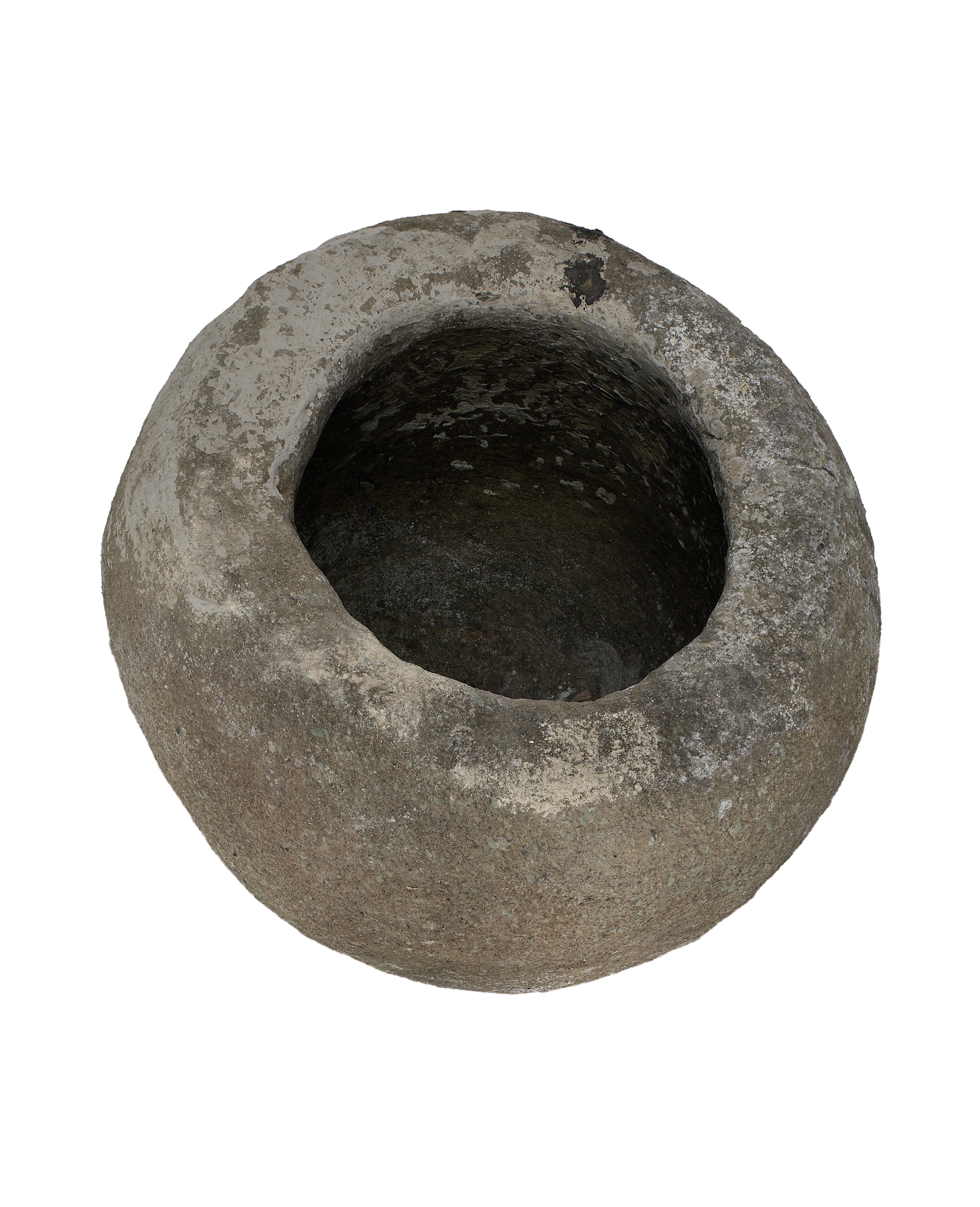 Vintage Indonesian limestone trough, top view of textured round opening and weathered surface.