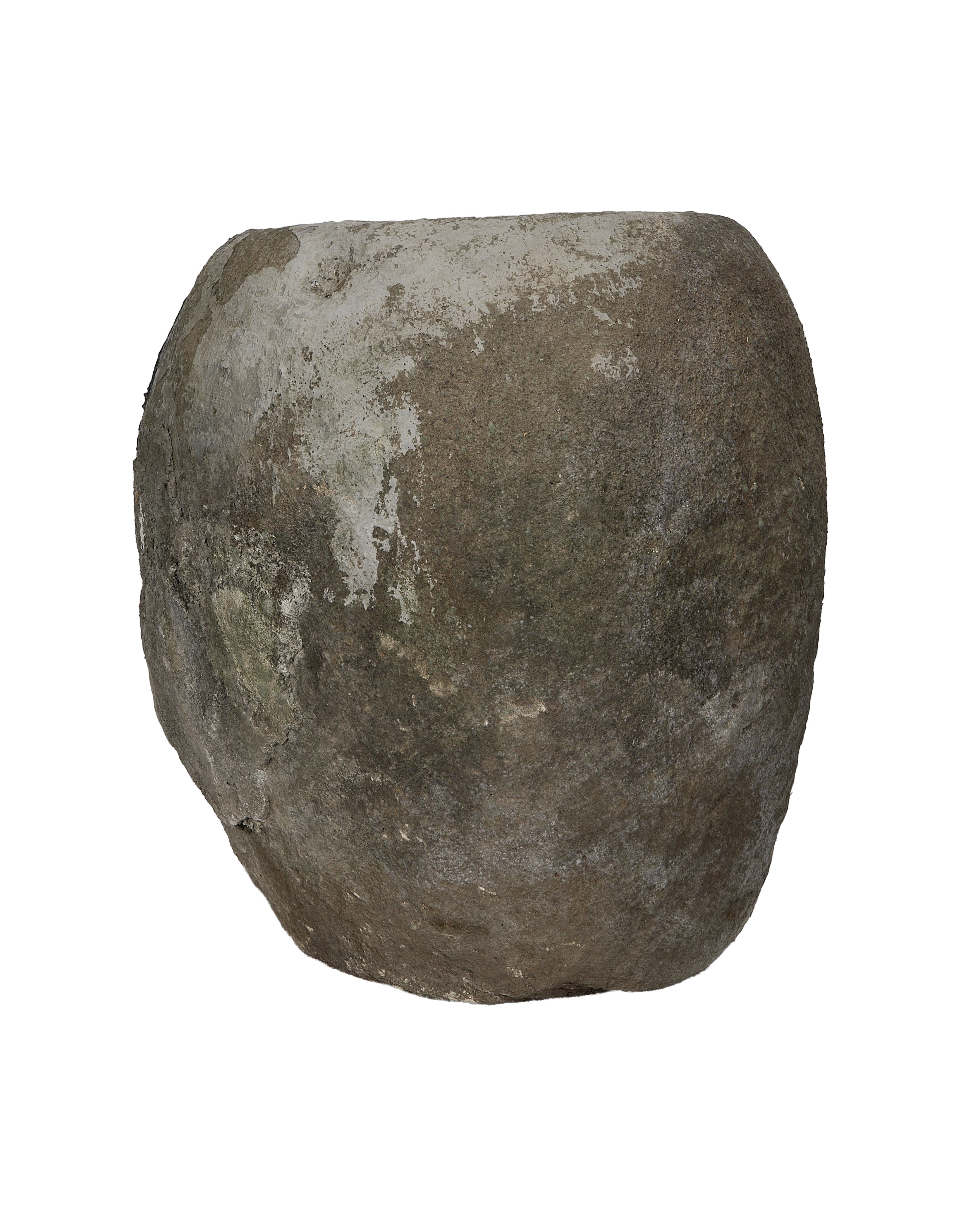 Vintage round Indonesian limestone trough showing weathered surface texture from a side angle.