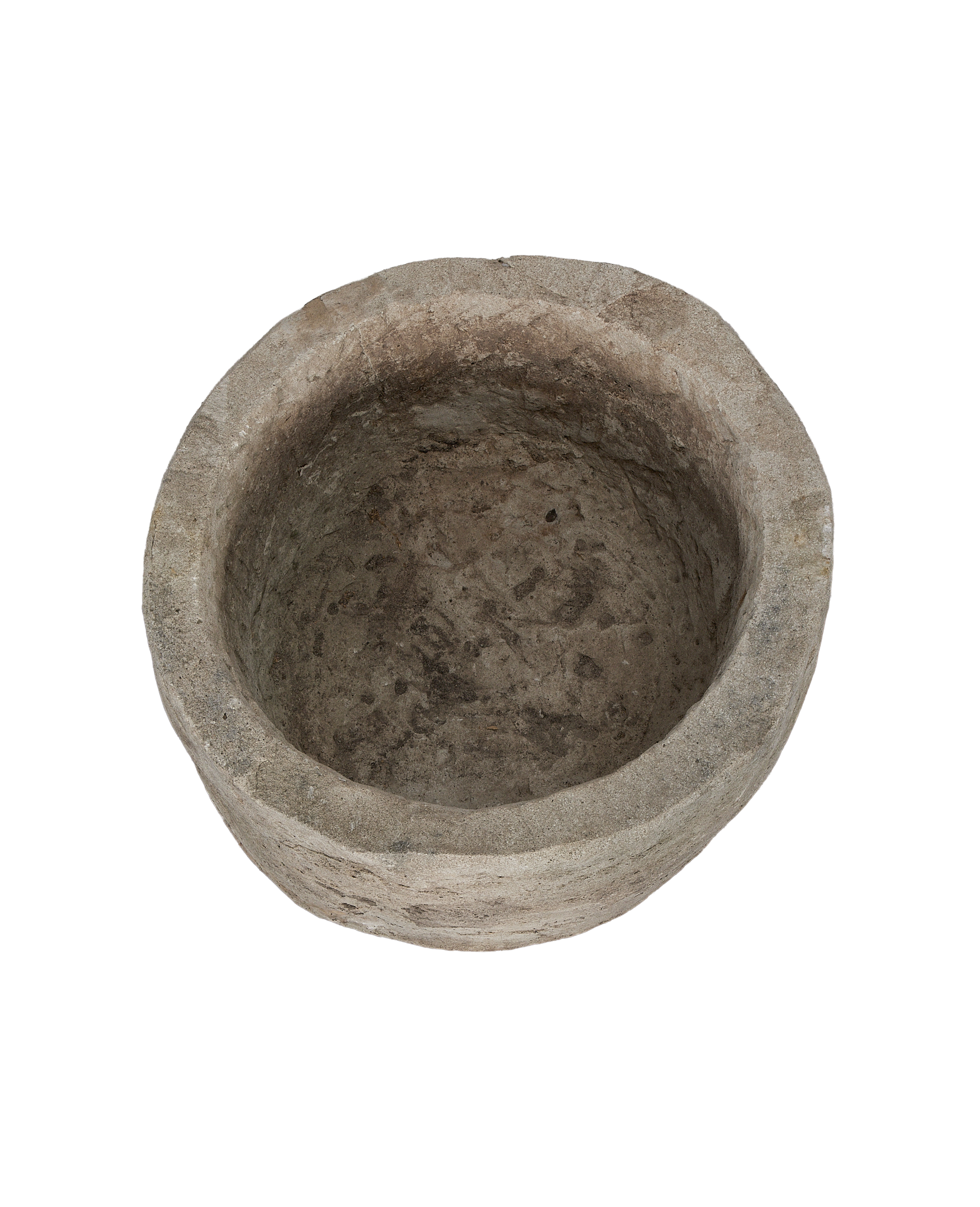 Vintage limestone round trough from above, showing rough weathered texture inside and on rim.