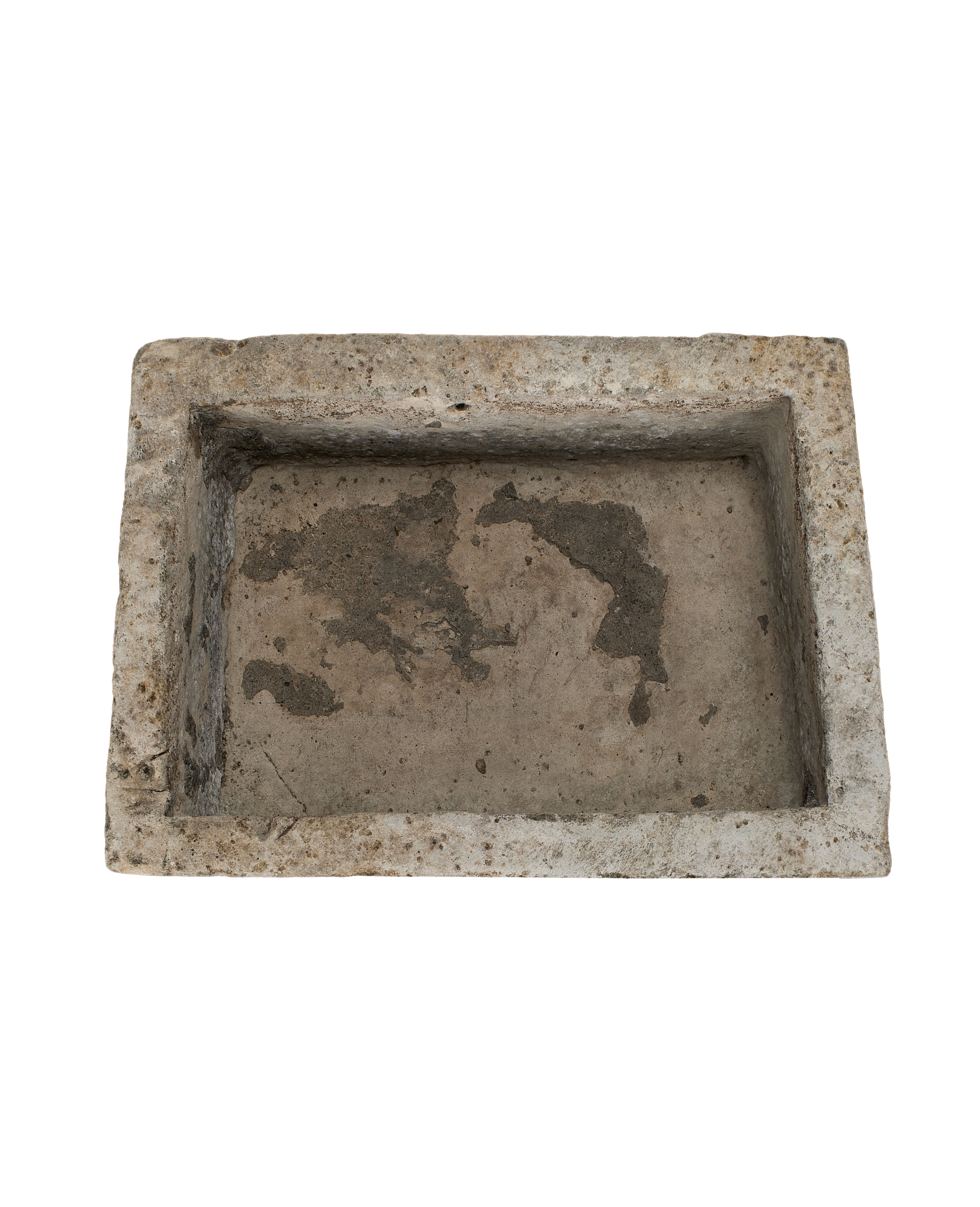 Vintage rectangular limestone trough, overhead view, showing the rough, weathered interior surface.