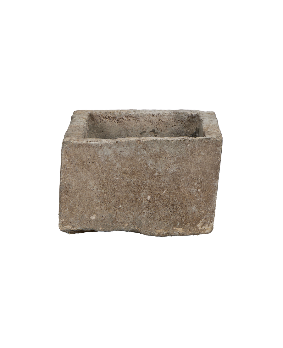 Vintage Indonesian gray limestone trough, side profile showcasing textured weathered patin
a.