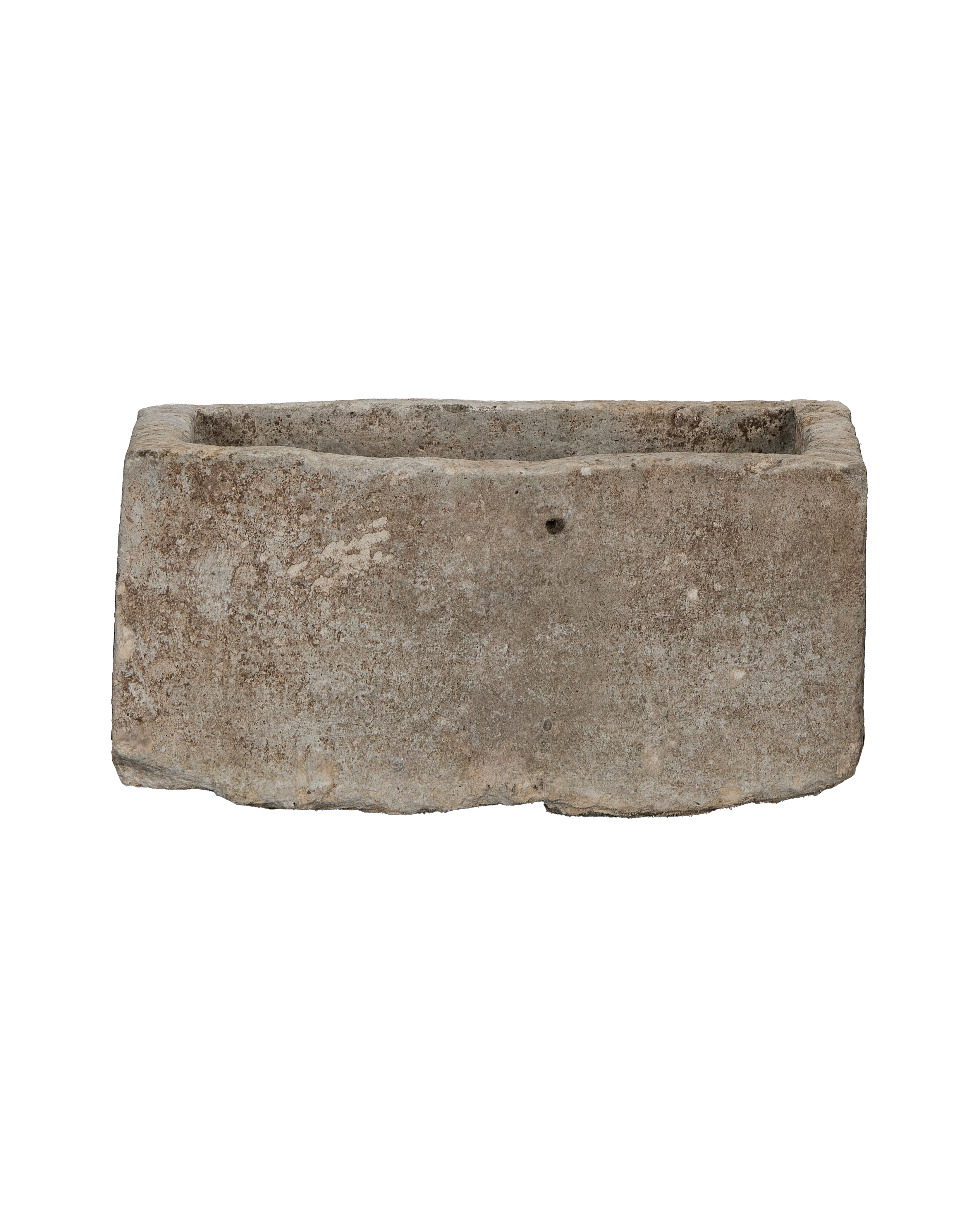 Vintage Indonesian rectangular limestone trough showing rough textured exterior, and interior rim.