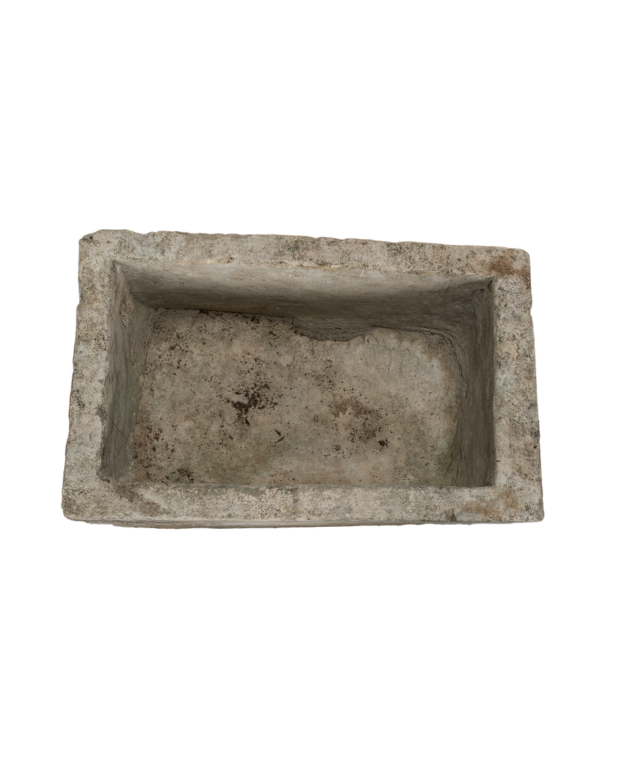 Vintage rectangular limestone trough, overhead view showing varied interior texture and weathered patina.