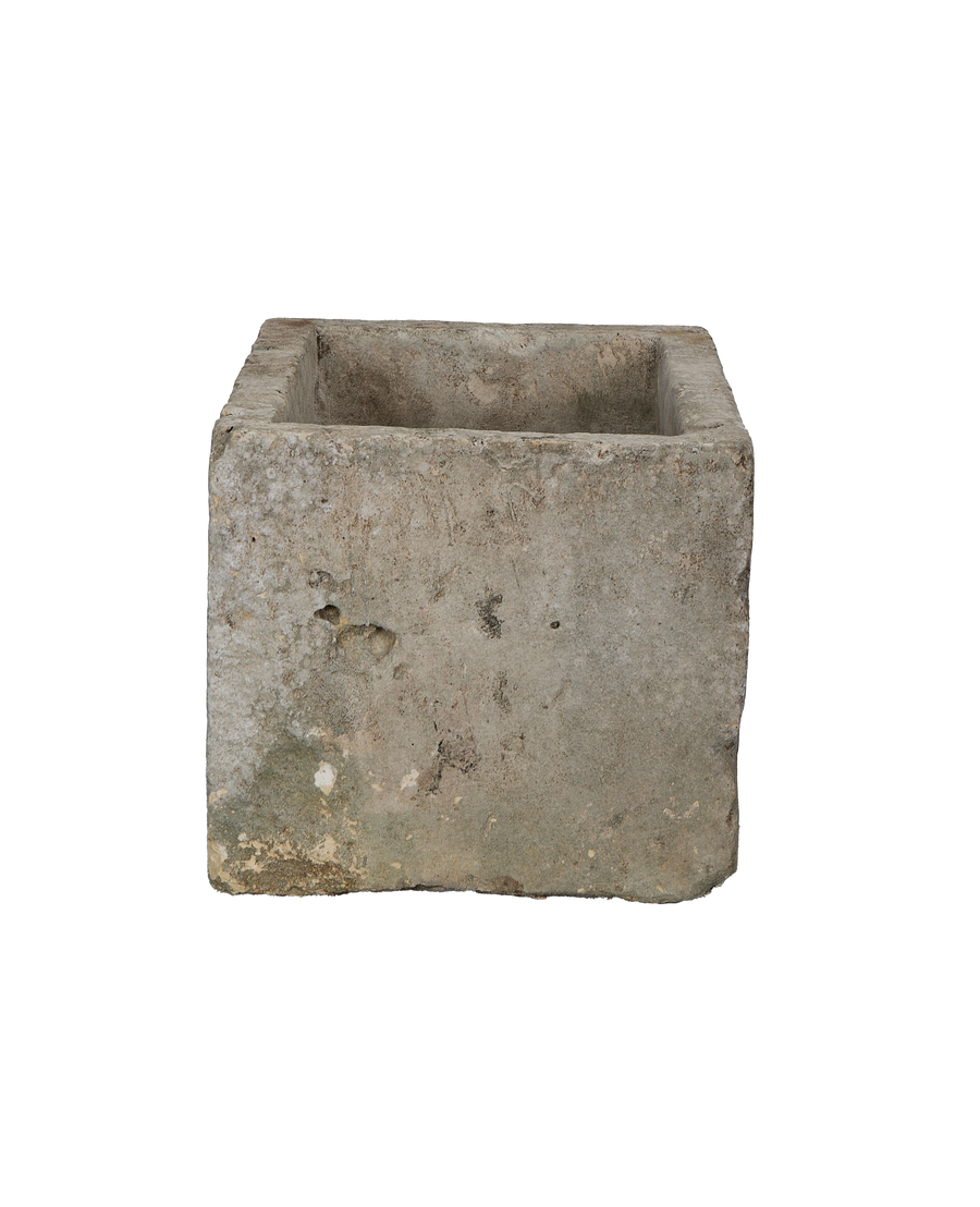 Vintage limestone trough from Indonesia, showing a rectangular open top with textured, weathered sides.