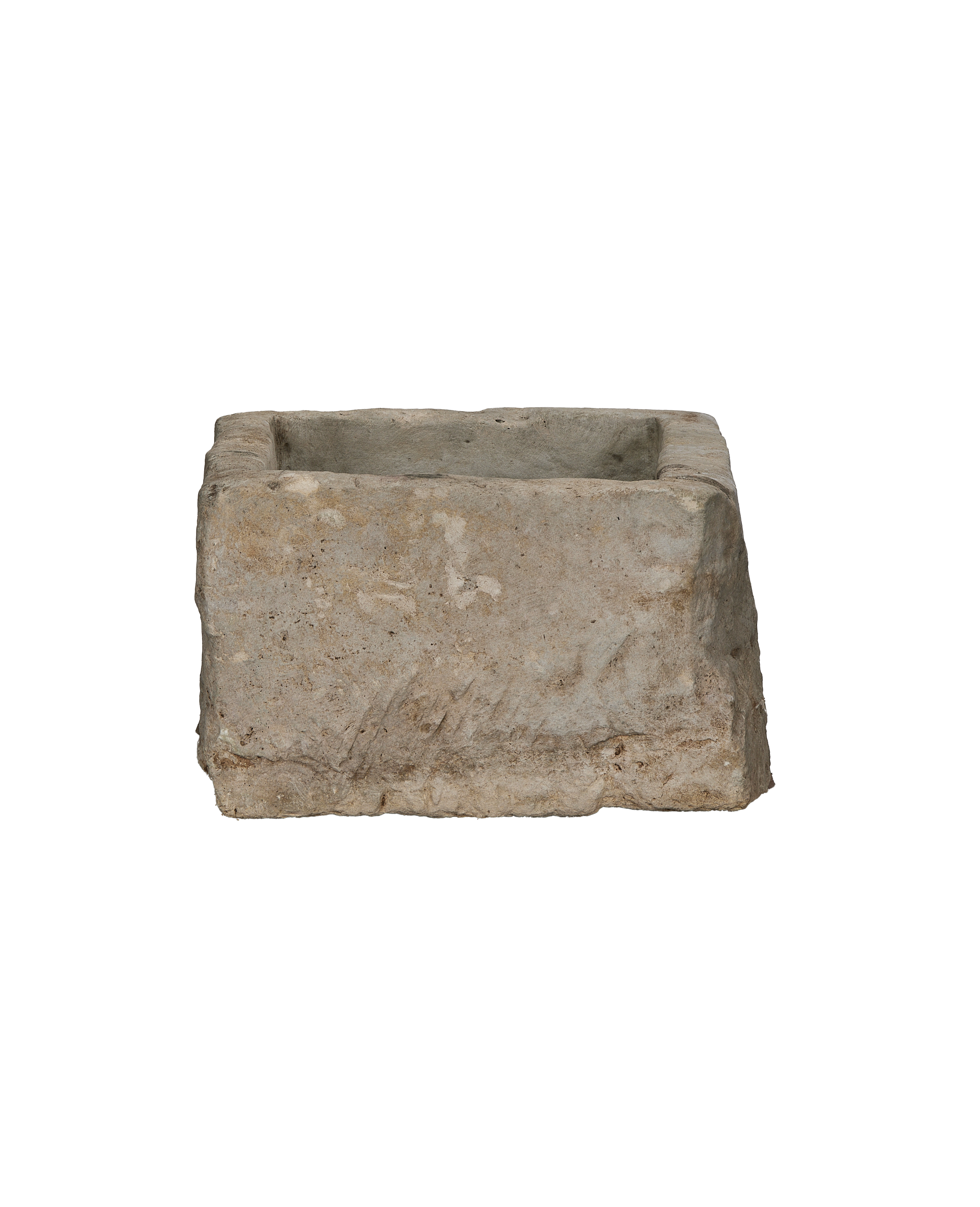 Vintage rectangular limestone trough, showing rough exterior texture and chipped edges.