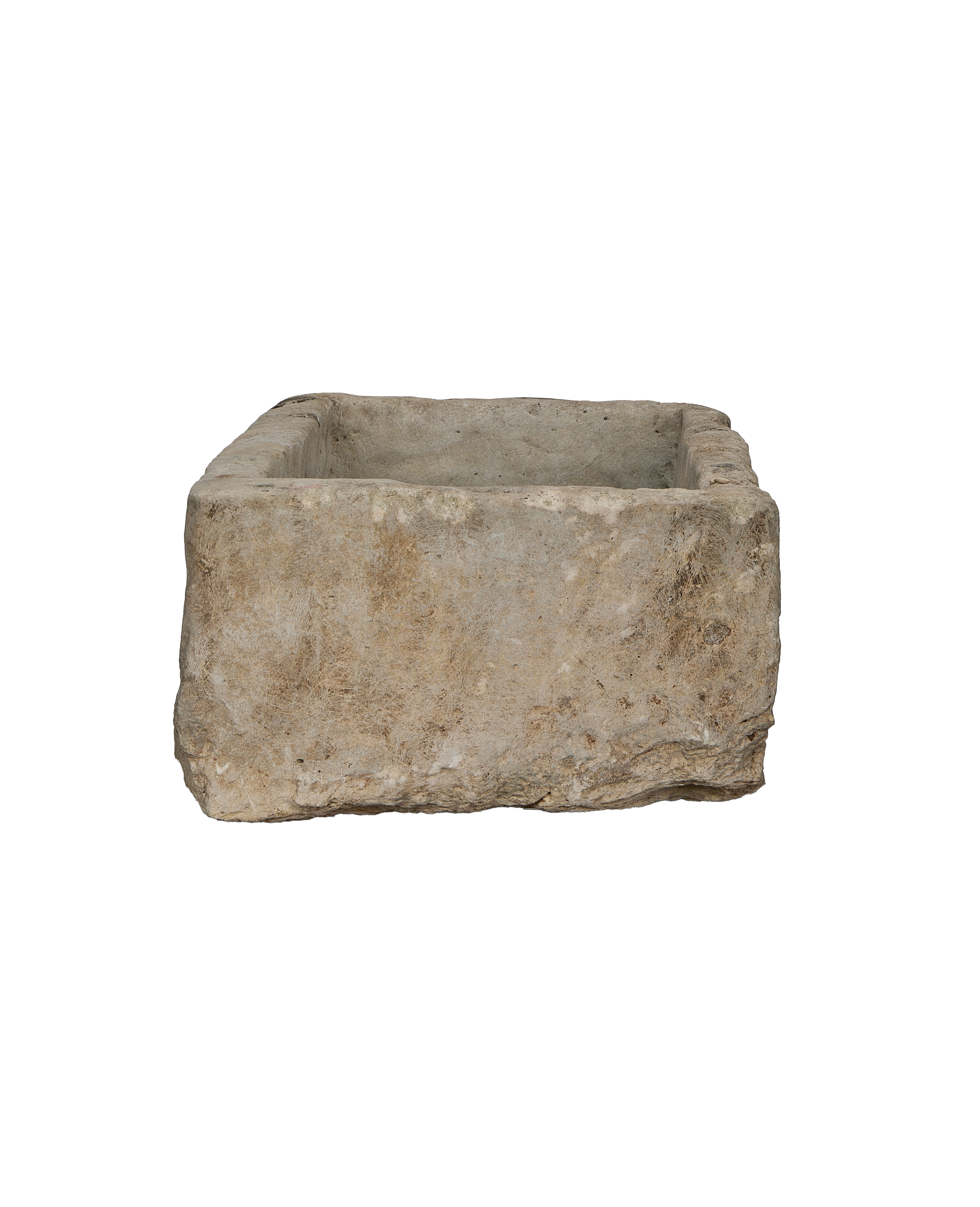 Vintage rectangular Indonesian limestone trough, showing a side view of its rustic texture and irregular edge.
