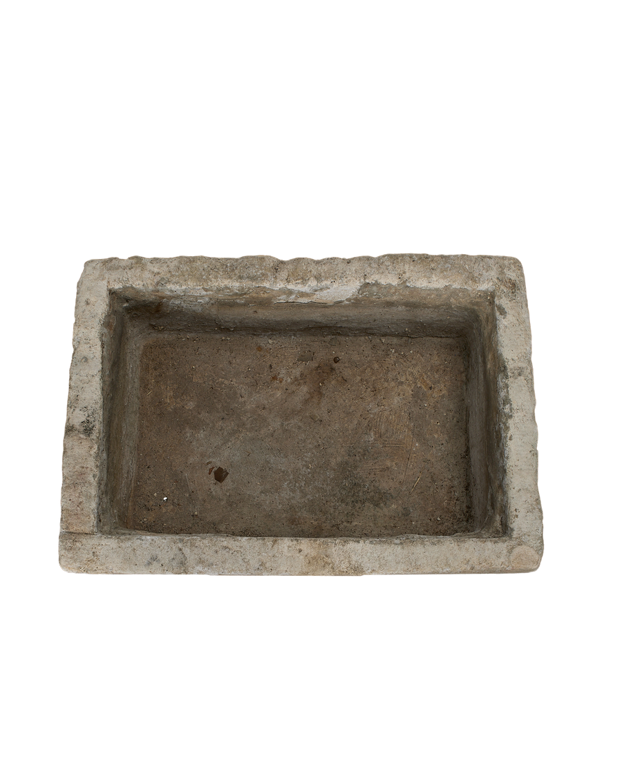 Vintage rectangular Indonesian limestone trough, top-down view showing interior texture and aged surface.