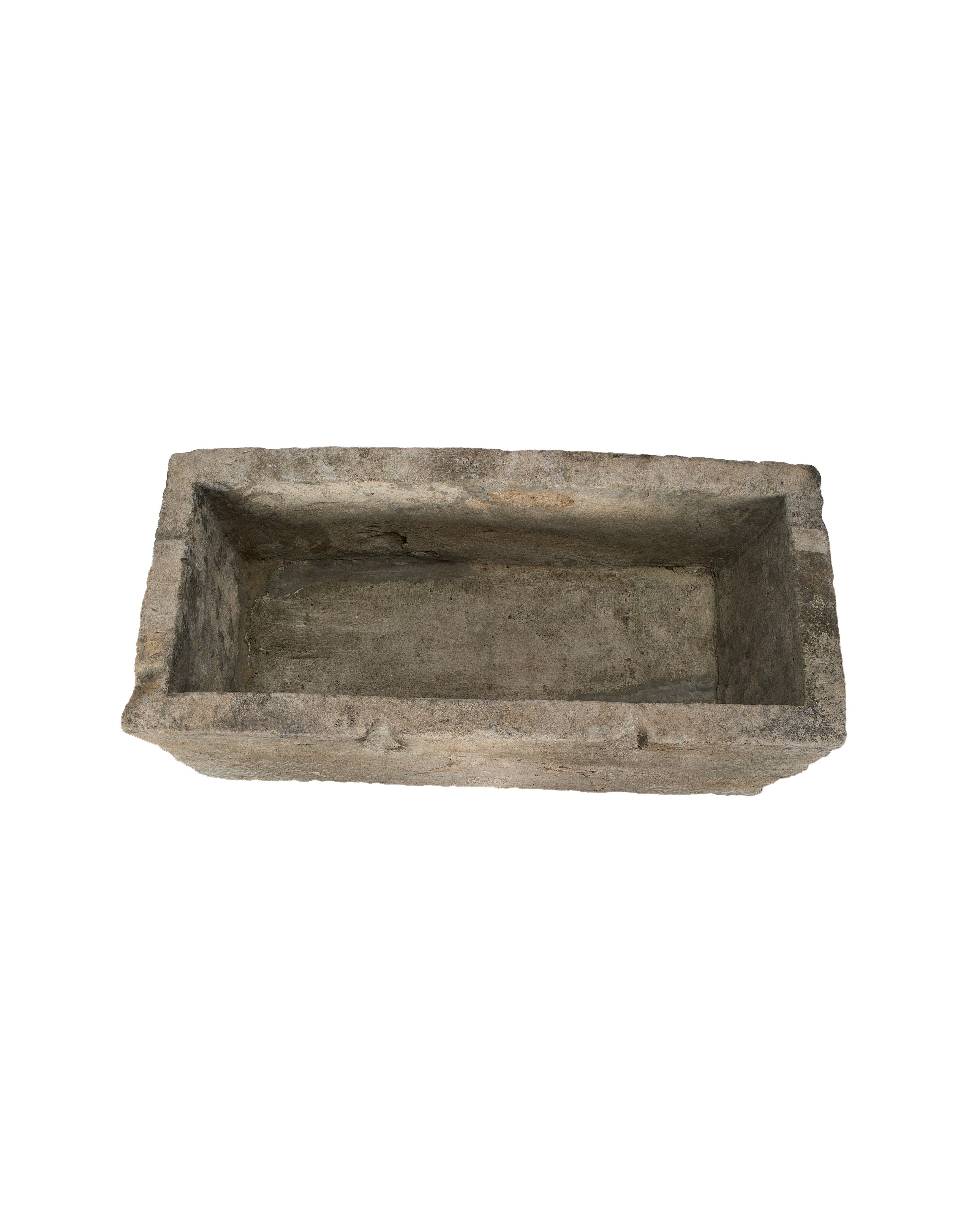 Vintage, rectangular Indonesian limestone trough, top-down view showing interior depth and rough texture.