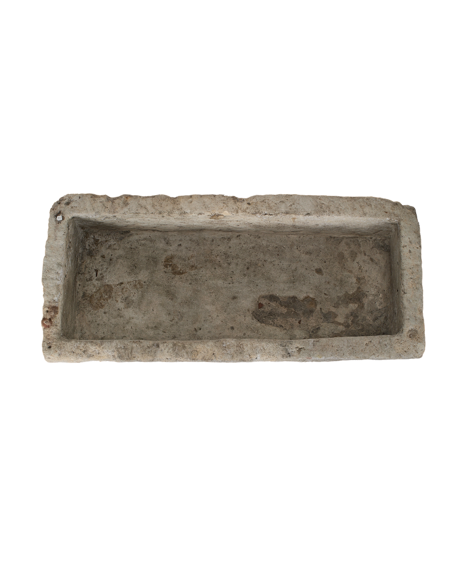 Vintage Indonesian limestone trough, top-down view highlighting the textured rectangular interior.