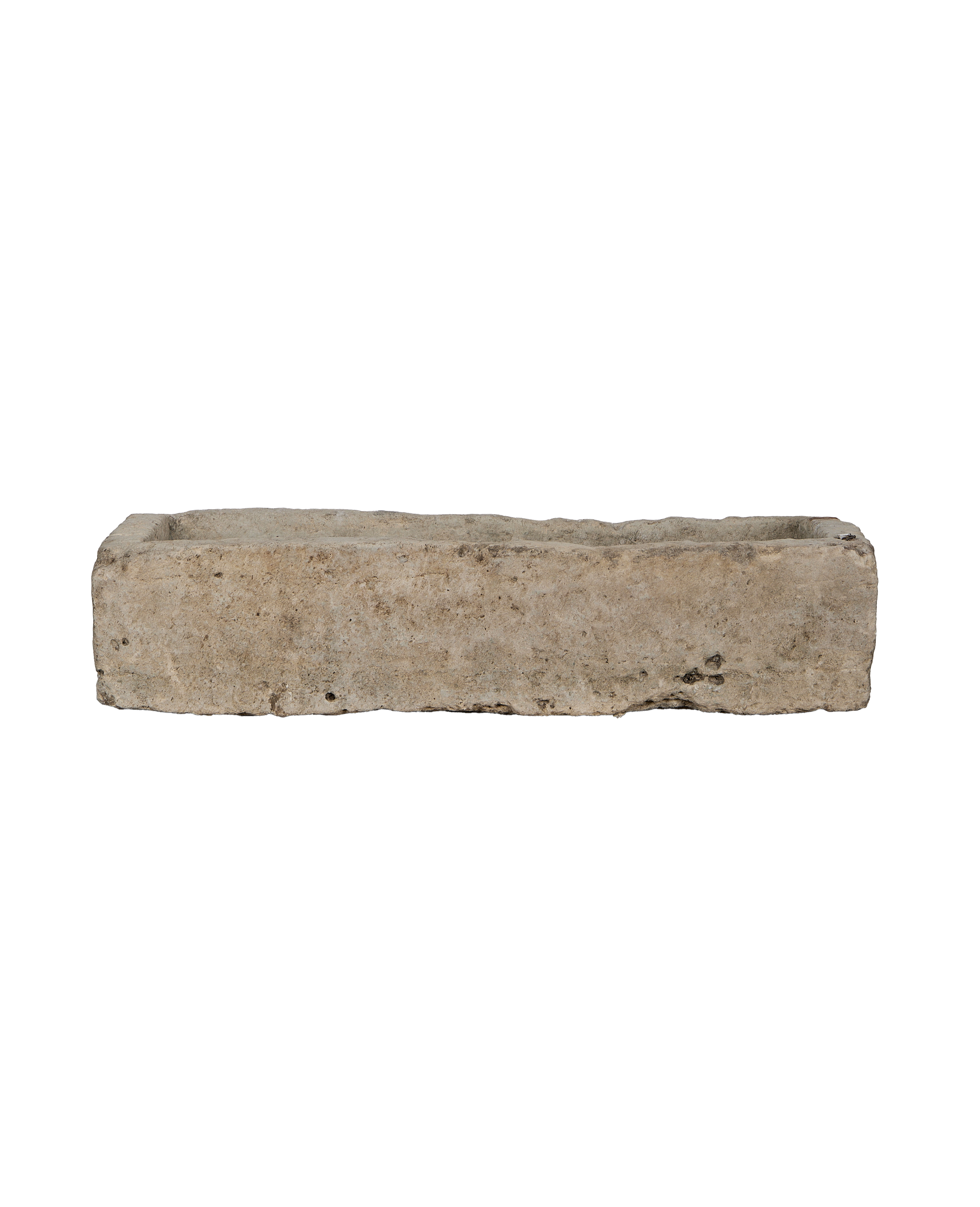 Vintage rectangular limestone trough, showing the rustic interior and weathered top edge from Indonesia.