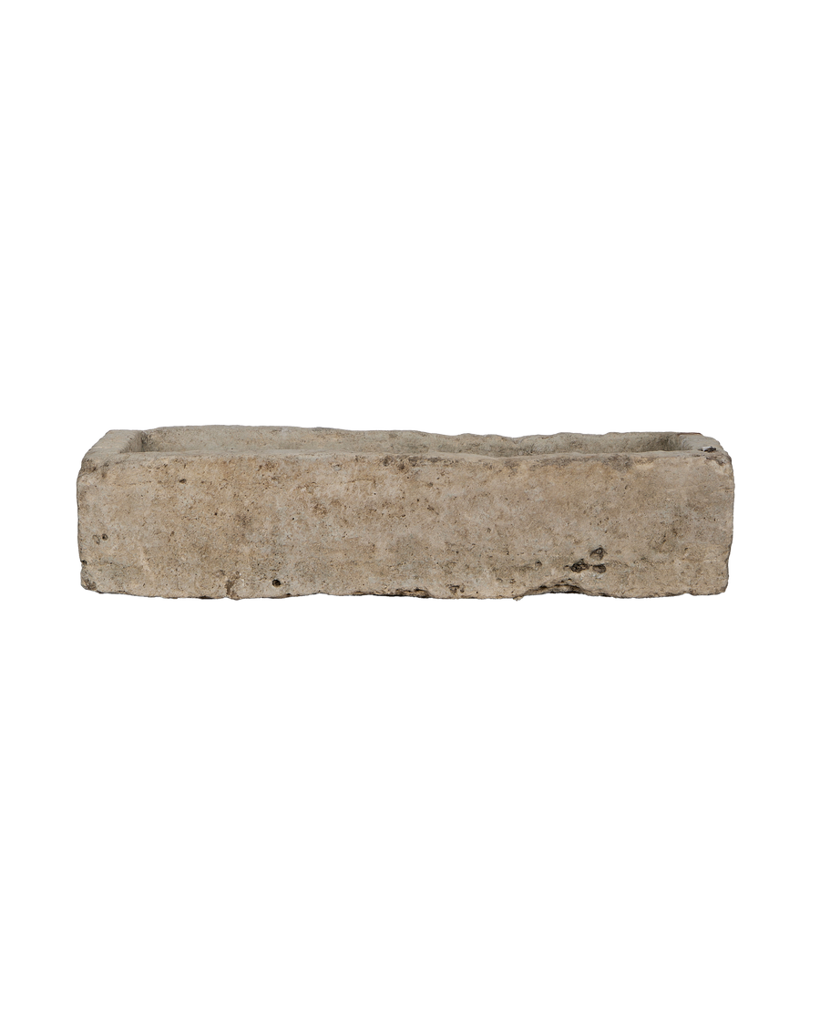 Vintage rectangular limestone trough, showing the rustic interior and weathered top edge from Indonesia.