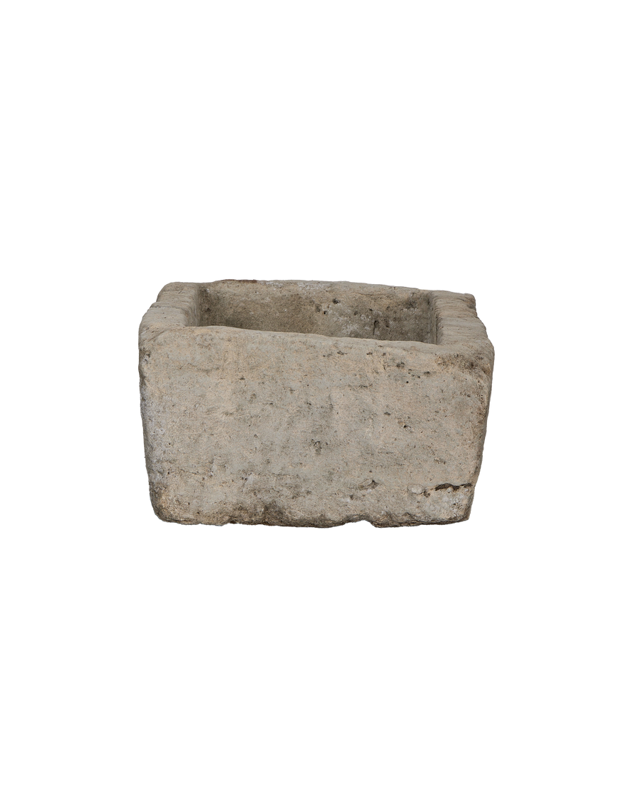Vintage Indonesian limestone trough, showing rough textured exterior and distinct rectangular shape.