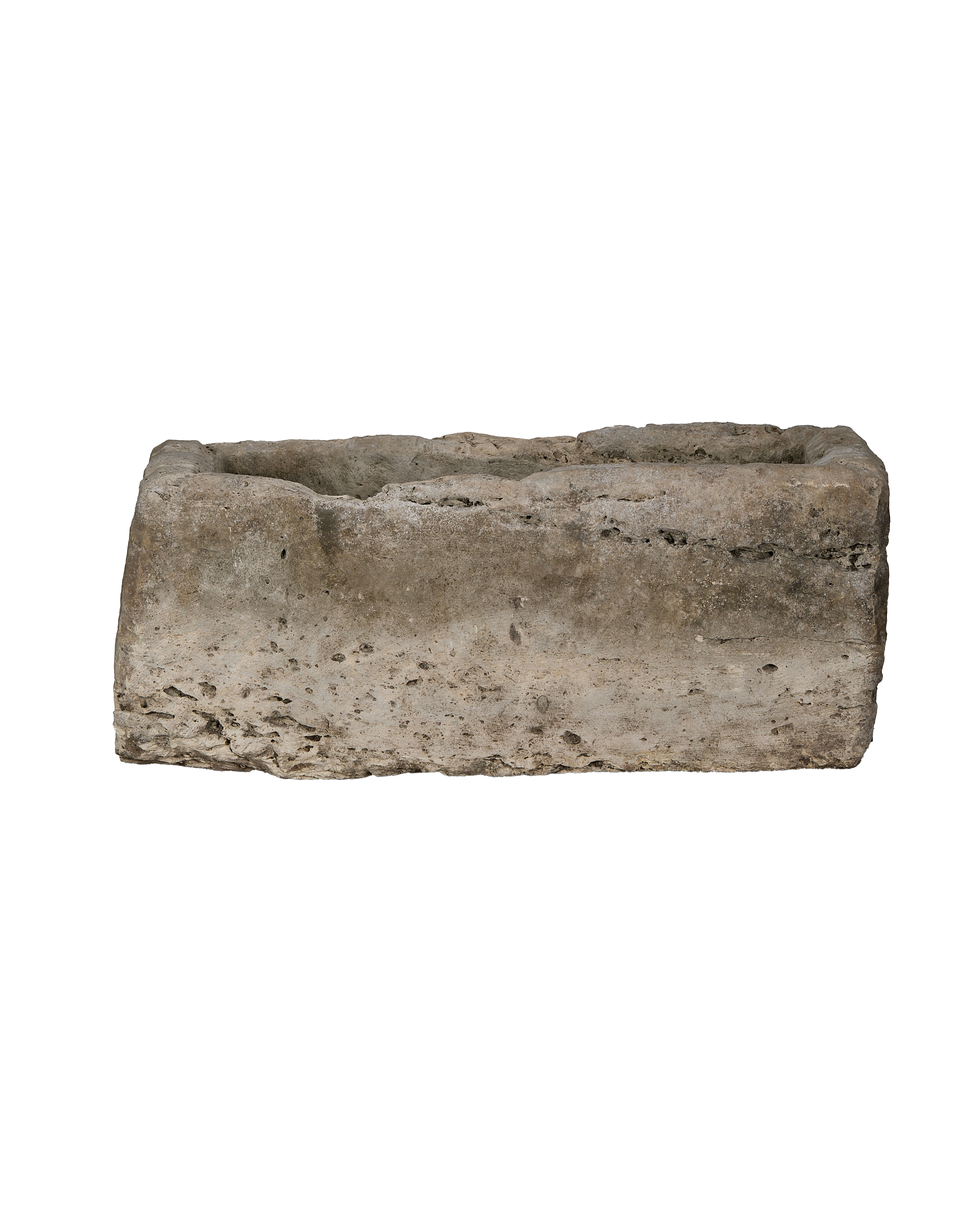 Rough-hewn vintage Indonesian limestone trough with rectangular shape and uneven, weathered texture.