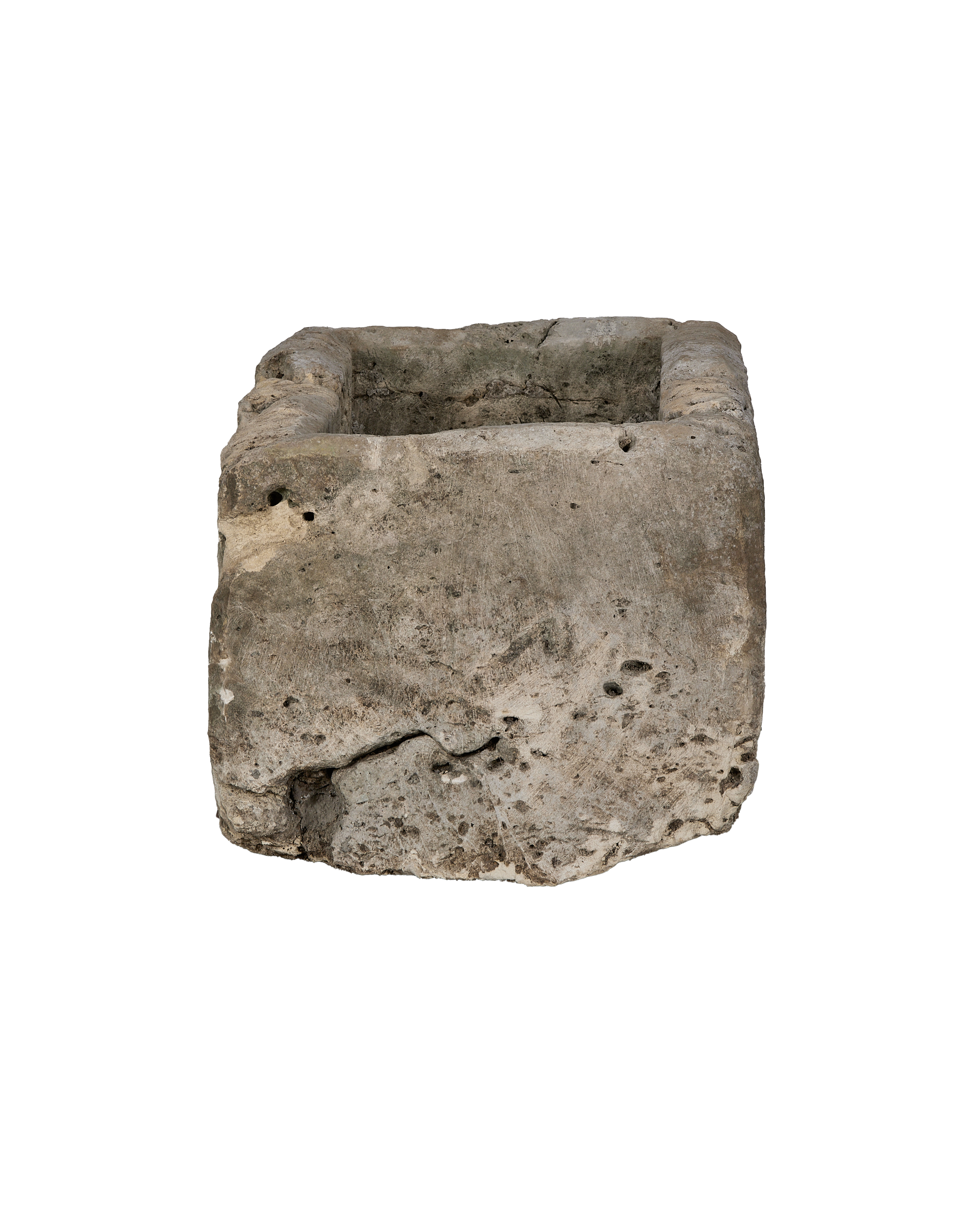 Vintage Indonesian limestone trough, displaying natural rough texture and aged cracks on its side.