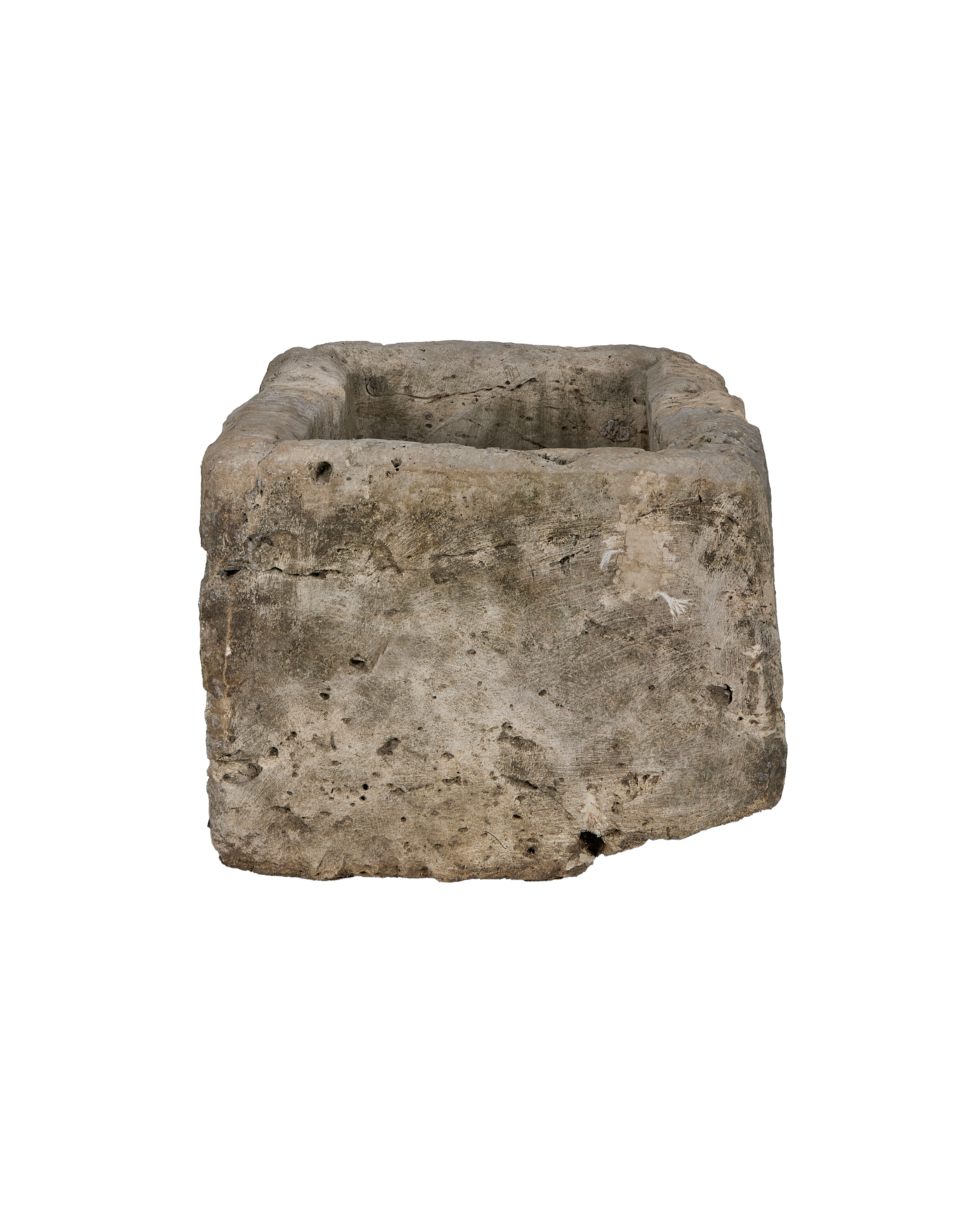 Vintage Indonesian limestone trough, detailed side view, rough texture, weathered patina.