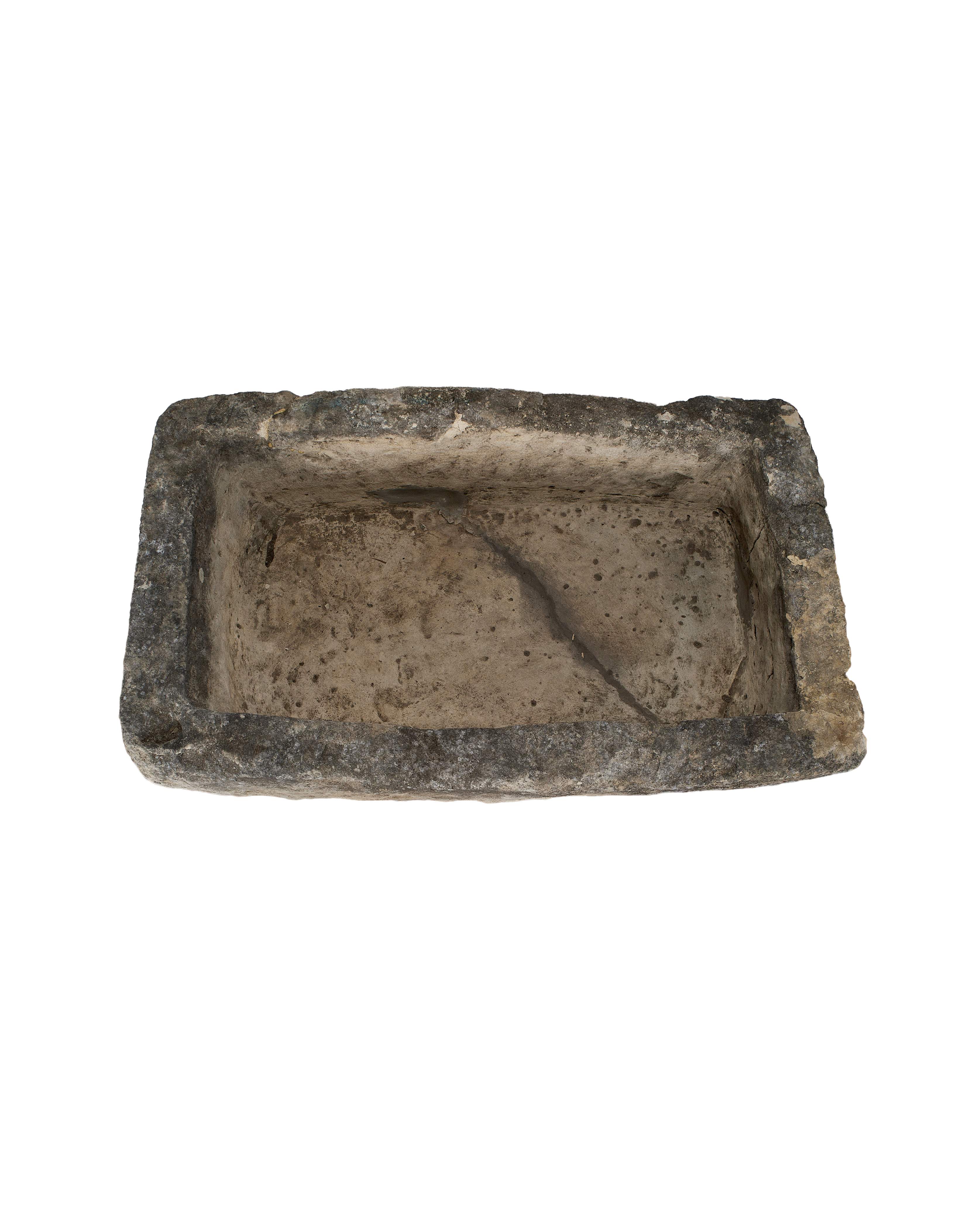 Vintage Indonesian limestone trough, top view revealing rough rectangular shape and weathered interior.