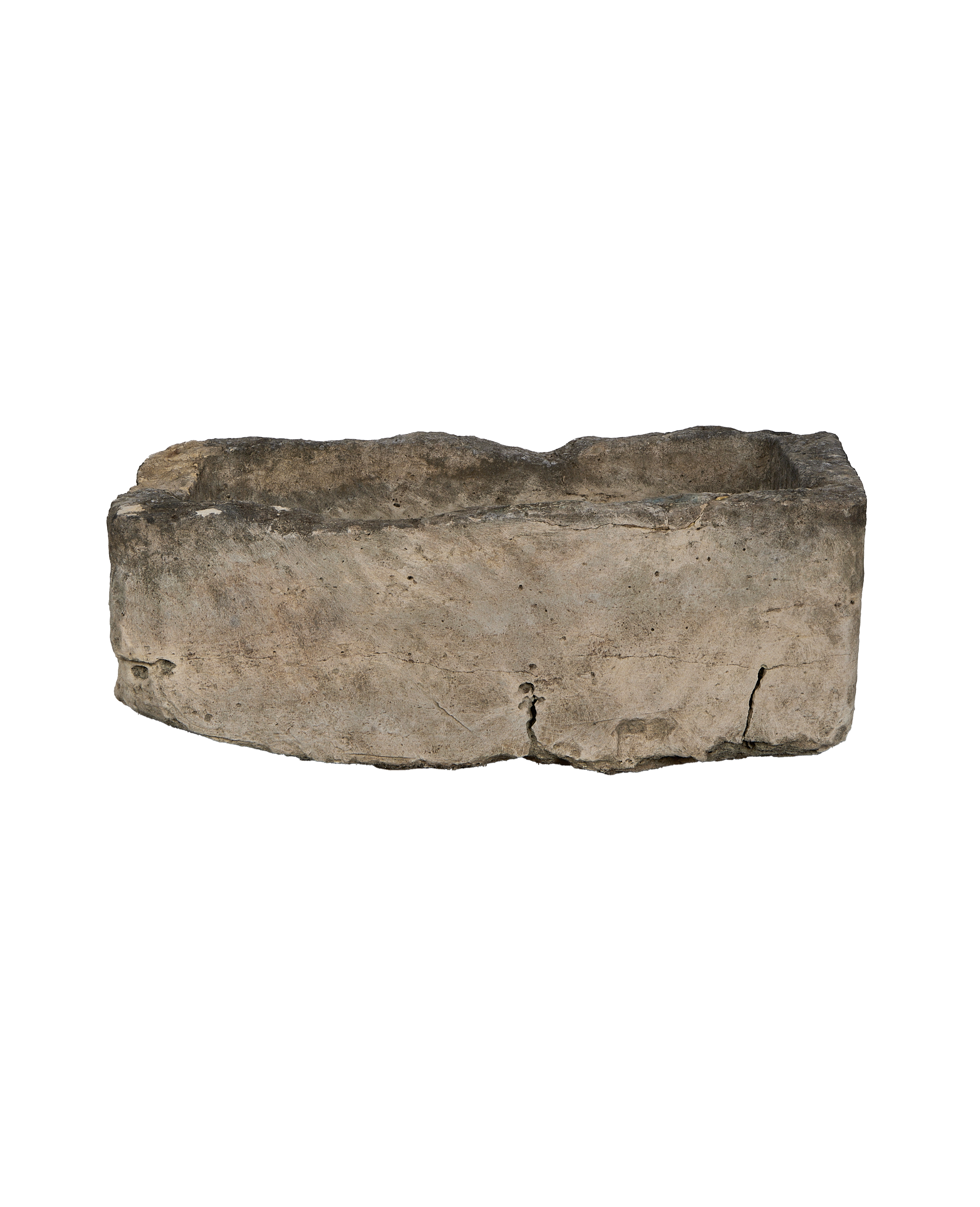Vintage Indonesian rectangular limestone trough showing rough textured exterior and cracks.