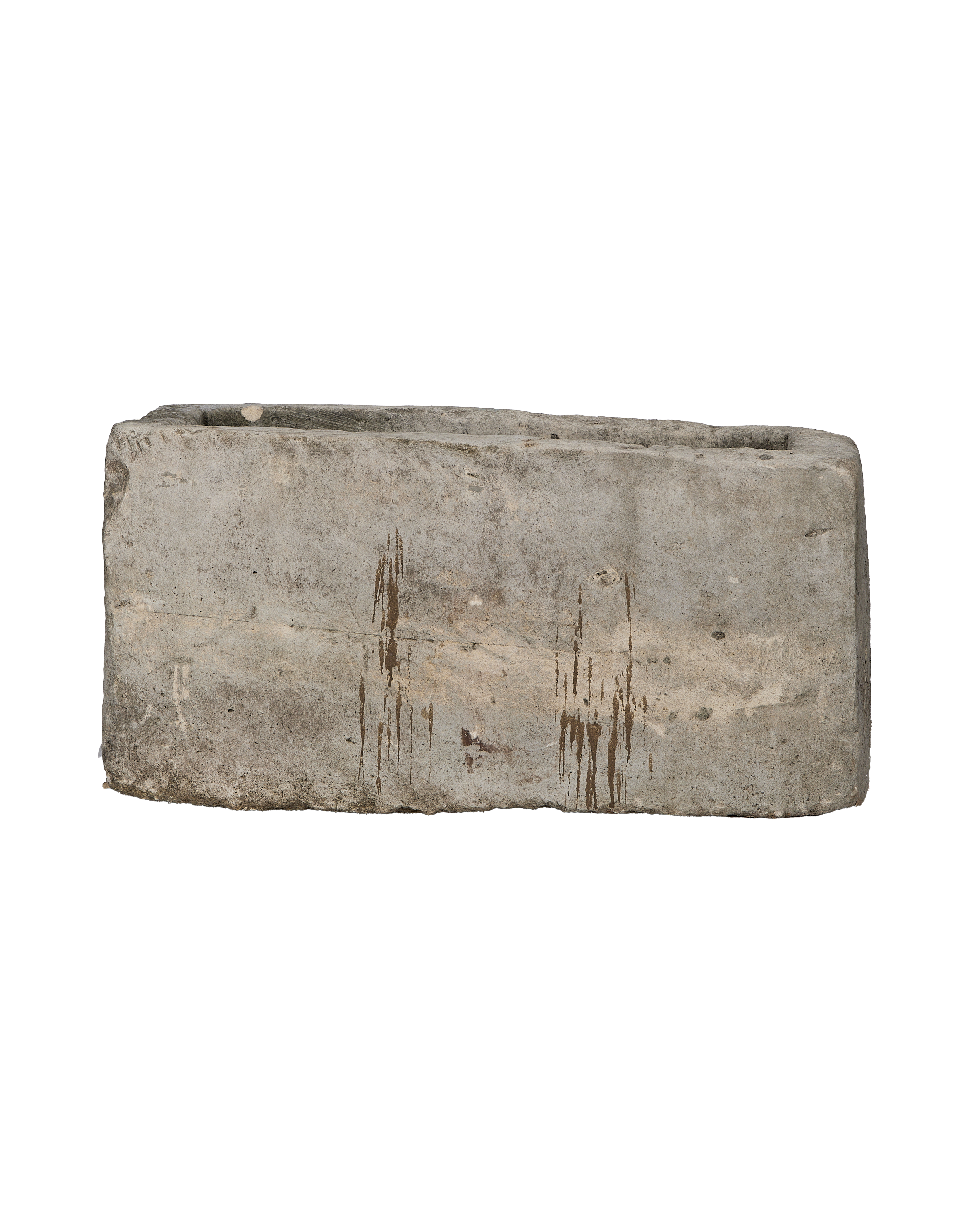 Vintage rectangular limestone trough, side view revealing rustic texture and brown streaking patina.
