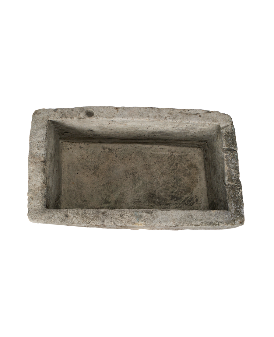 Vintage rectangular Indonesian limestone trough with weathered natural patinated interior, top-down view.