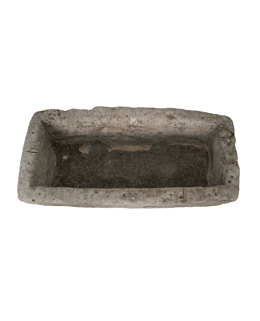 Vintage Indonesian rectangular limestone trough, top-down view showing interior texture and worn edges.