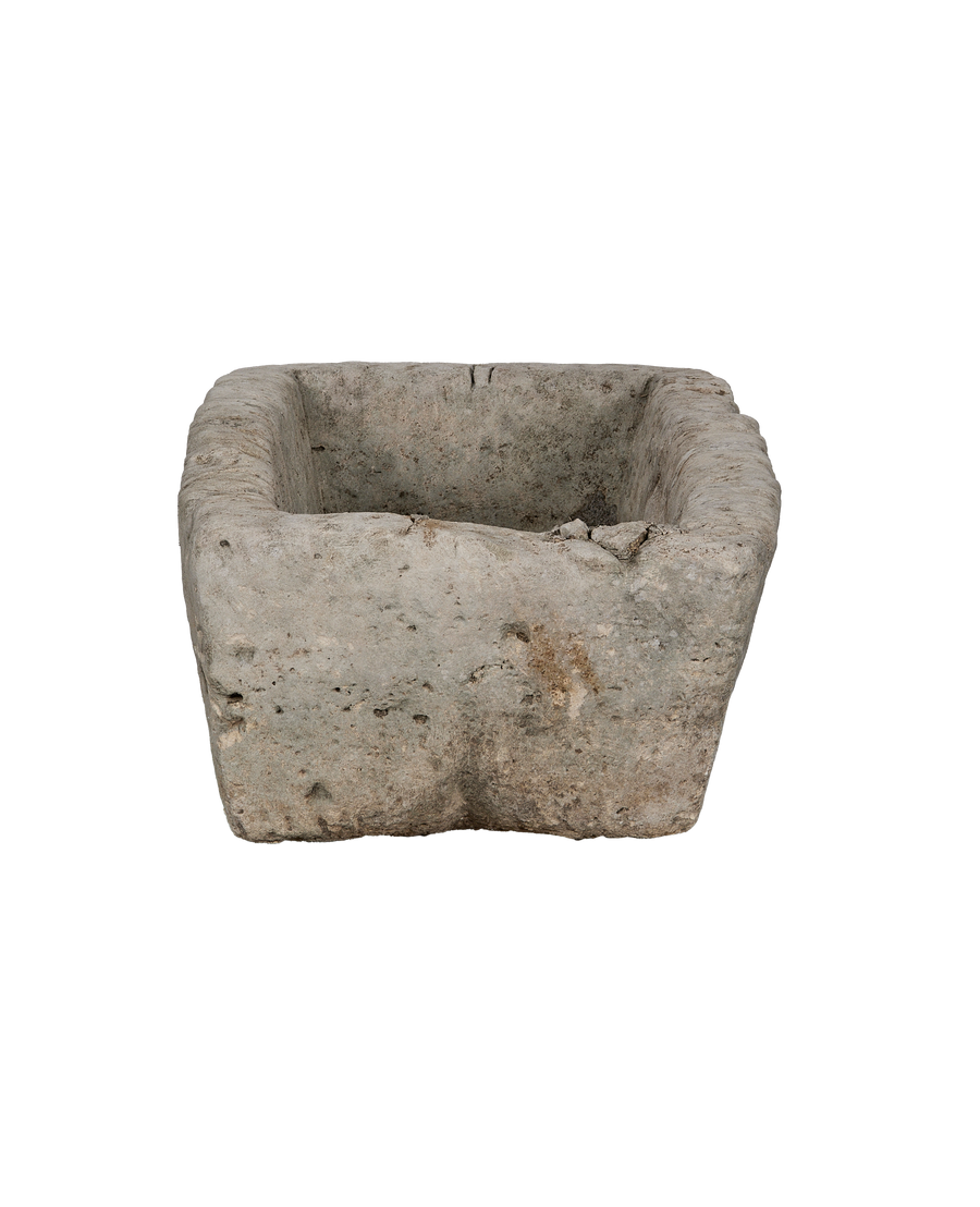 Vintage Indonesian limestone trough top-down angle, showing interior detail and rough texture.