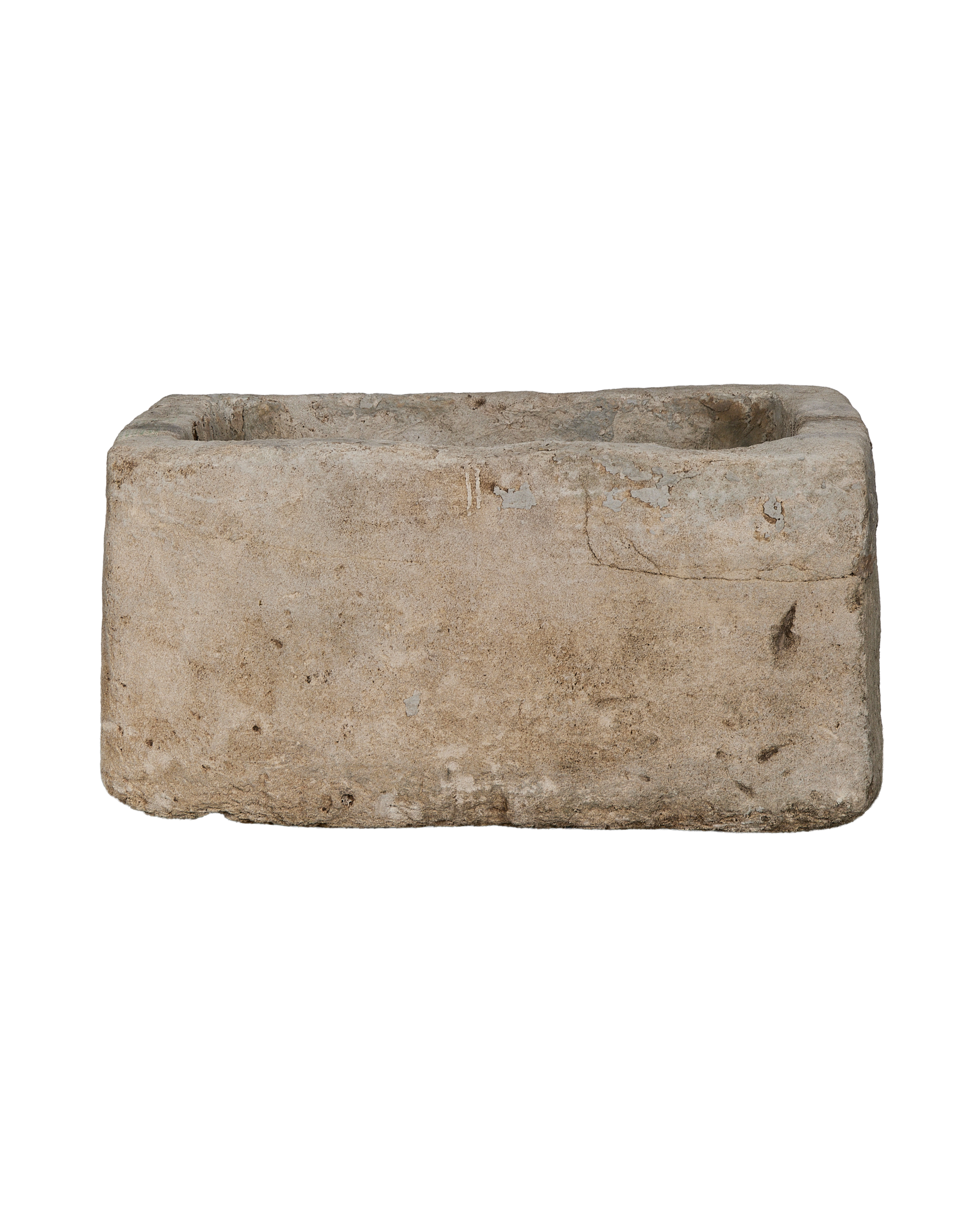 Vintage Indonesian limestone trough showing weathered light gray texture and worn edges.