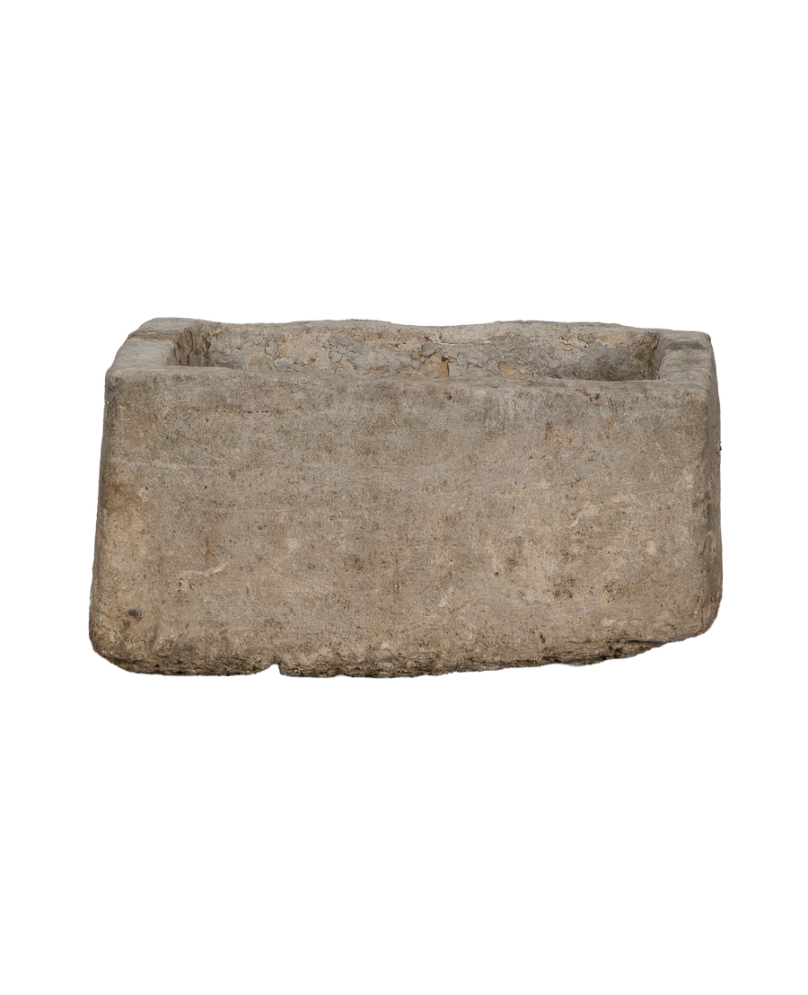 Vintage Indonesian limestone trough, rectangular, from a lower side angle, showcasing rustic texture.