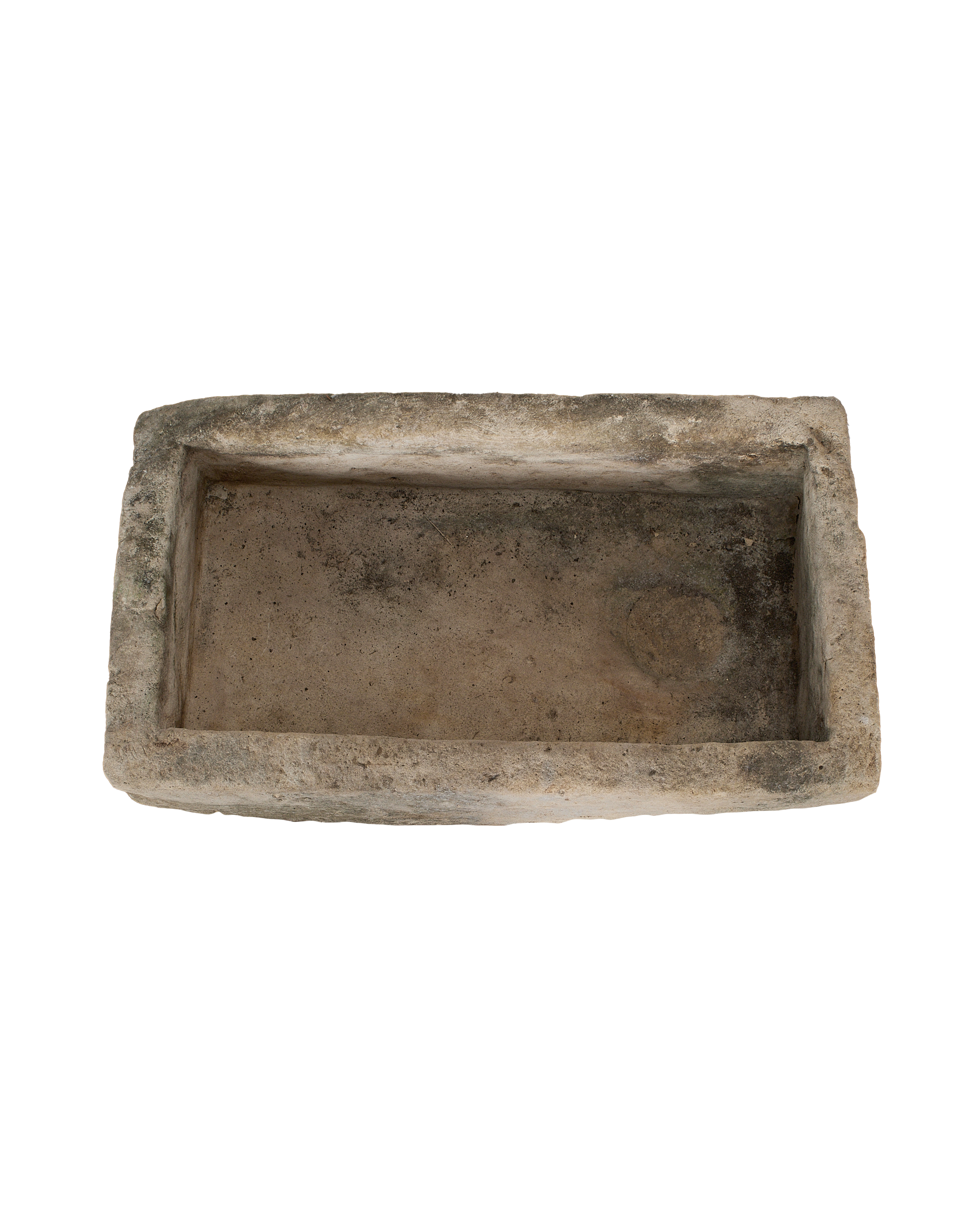Vintage Indonesian limestone trough, top-down view showing interior basin, varying texture.