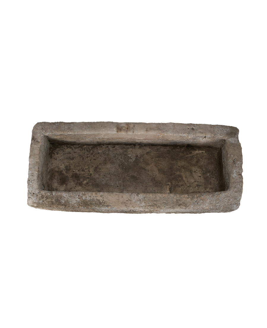 Vintage Indonesian limestone trough, top-down view showing rectangular basin with rustic texture.