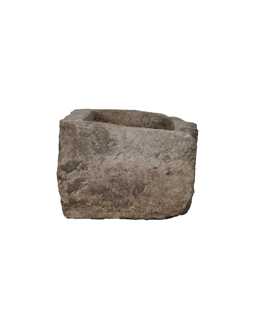 Vintage Indonesian rectangular limestone trough, rustic greyish texture, top-down angled view.